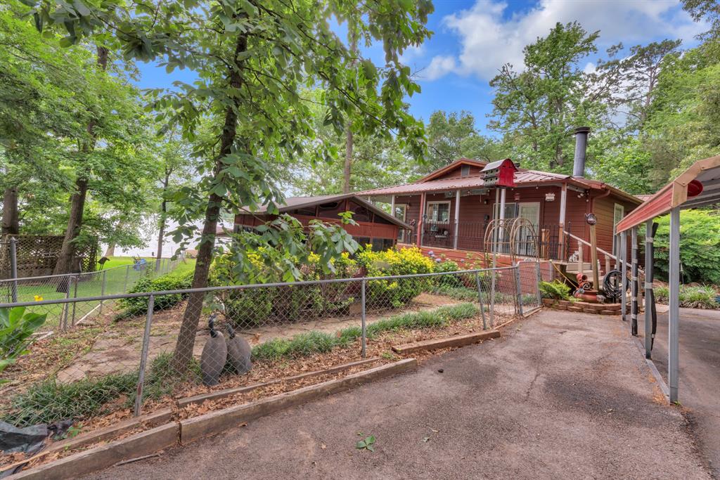 Owners are ready to move!!  Priced below market Value this waterfront retreat on Lake Cypress Springs featuring a 3-bed, 2-bath hilltop home on a wooded half-acre lot with approximately 250 ft of shoreline. Property includes a private boat slip, refinished retaining wall, full sprinkler system, and access to community amenities including boat ramp, park, and pool.

Open floor plan with lake views, dedicated office, oversized utility room, electric cooktop, built-in microwave, and new dishwasher. Second living area offers bay windows, built-in shelving, and flexible use options.

Primary suite includes gas fireplace, private exterior access, large walk-in closet, oversized shower, dual sinks, and lake views. Exterior features include metal roof, paved driveway, two carports, enclosed hot tub, wraparound porch, and an 18×18 deck overlooking the water.

Suitable for full-time living, weekend use, or remote work with a peaceful lakeside setting.