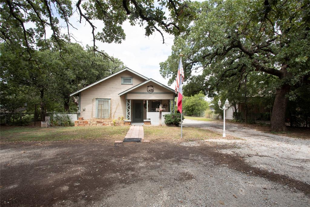 Welcome to this rare find — a charming property that offers the peace and privacy of country living while being conveniently located within the city limits. Nestled on one acre adorned with mature oak trees, this home provides both shade and natural character, making it the perfect retreat.

Inside, the residence features central heating and air, ensuring year-round comfort. The layout offers plenty of potential for personal touches, whether you’re looking for cozy family living or room to entertain.

Step outside to enjoy the spacious lot, complete with a fenced-in side yard—ideal for pets, gardening, or outdoor gatherings. At the back of the property, you’ll find a workshop and a dedicated man cave, providing the perfect space for hobbies, storage, or relaxation.

With its combination of acreage, mature trees, and versatile outbuildings, this property offers a unique opportunity to enjoy extra space and a country atmosphere without giving up the convenience of city access.