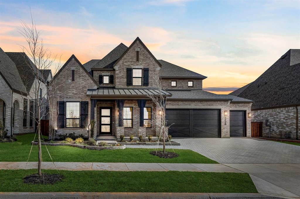 MLS# 21265111 - Built by Tradition Homes - Ready Now! ~ Beautiful two-story home with an expansive Great Room and a cozy Hearth Room. The luxurious owner’s suite showcases 12' vaulted ceilings, a charming box window, and a spa-like bath with dual vanities, a large shower, and a relaxing soaking tub. A walk-in closet with a convenient pass-through to the laundry room completes the space. Upstairs offers a spacious game room, media room, and versatile flex room for added lifestyle options.