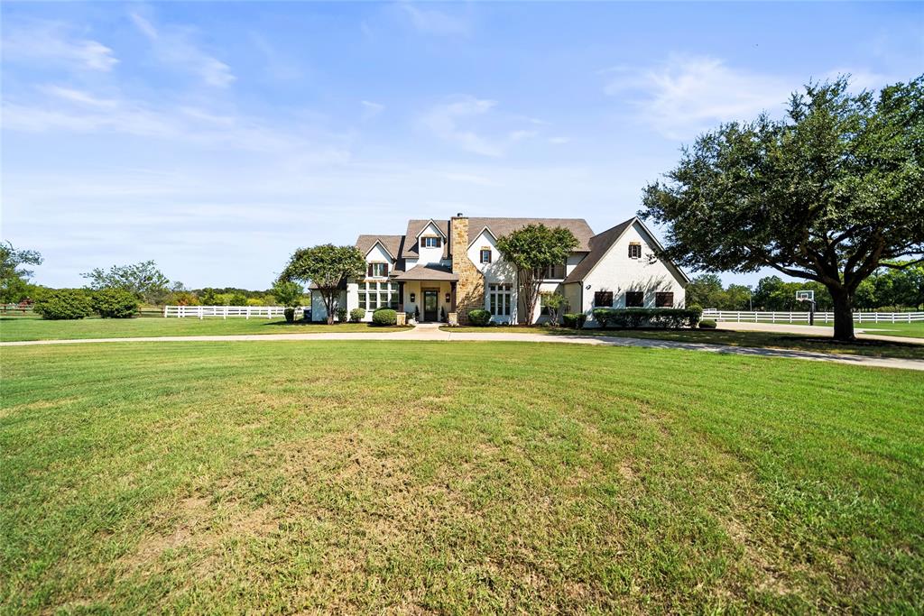 Welcome to this stunning custom 5 bedroom, 5.5bathroom home that offers the perfect blend of luxury and comfort on 5 Ag Exempt acres. Featuring an oversized 3 car garage, 3-stall stable, and a pool with hot tub and waterfall, the property is powered by a 12 kW solar system with 2 Tesla battery banks. Inside, you'll find a grand entry with a barrel ceiling, a chef's kitchen with high-end appliances, and tastefully updated with designer touches throughout. Located in the highly sought-after Argyle ISD and Liberty Christian Schools, this home is tucked away in a peaceful cul-de-sac, offering tranquility without sacrificing convenience. Come experience the perfect balance of serene country living and modern luxury today!