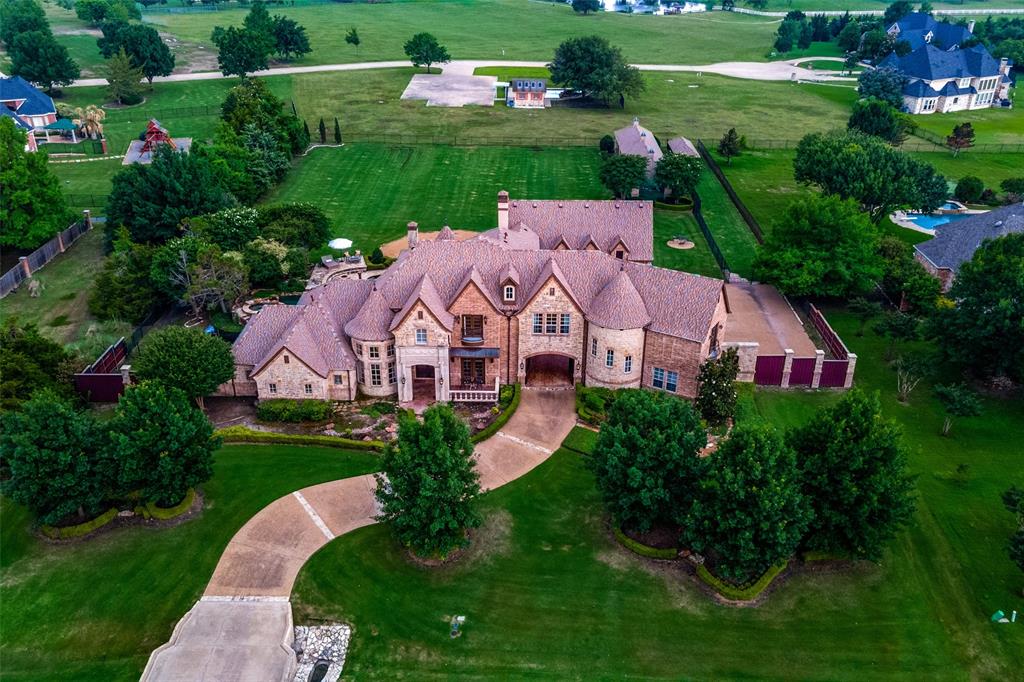 Exclusive French-Country estate located in a private gated community nestled on a 1.4 acres with your very own personal outdoor oasis. This home offers 5 bds (incl. guest suite with private entrance) 5.2 baths, 2 laundry, 3 fireplaces, 3 staircases, GmRm & separate Theater Rm plus an oversized 3 car gar with TONS of storage! Chef’s gourmet island kitchen offers commercial grade appliances & dual dishwashers. Enjoy the exquisite woodwork and gorgeous breakfast nook overlooking the pool! Your newly refreshed primary suite features a fireplace, sitting lounge & oversized impressive custom closet. Experience luxury living at its finest on your 1,200sf covered outdoor living area w fireplace overlooking pool & spa w waterfall, baby pool, beach area plus a fire pit, basketball ct & covered batting & pitching cage & a sep dog kennel & dog run. Perfect estate for entertaining! MANY upgrades have been recently made to this property, including an all-new HVAC system. Location A+ , close to lake!