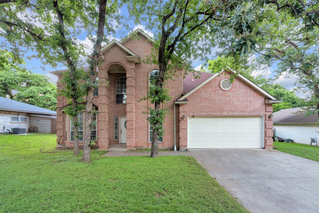 Welcome to 2119 Twin Elms Drive, a spacious two-story home nestled among mature trees in an established Arlington neighborhood. Step inside to soaring ceilings, abundant natural light, and an open-concept layout designed for both everyday living and entertaining. The inviting living room features a fireplace, built-in cabinetry, and views of the second-floor overlook.

The kitchen offers extensive cabinet and countertop space, a center island, built-in appliances, breakfast area, and seamless flow into the main living spaces. A dedicated front room with French doors provides flexibility for a home office, study, additional living area or bedroom.

The primary suite is located on the first floor and features a spacious bedroom, dual vanities, soaking tub, separate shower, and walk-in closet. Upstairs, a large game room or flex space is accompanied by additional secondary bedrooms and an updated bath.

Recent updates include luxury vinyl plank flooring, updated lighting, refreshed kitchen finishes, renovated secondary bathroom, and upgraded primary shower. Outside, enjoy a covered patio overlooking the fenced backyard with plenty of room for outdoor activities.

Conveniently located near shopping, dining, parks, entertainment, and major commuter routes with easy access to Arlington's premier attractions.