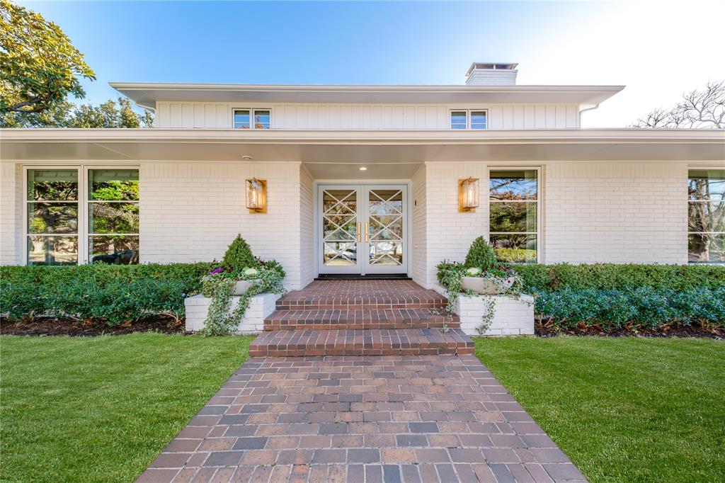 Stunning timeless design with modern updates in highly desirable Russwood Acres. Situated on .508 acre lot, the home is thoughtfully designed to offer seamless indoor-outdoor living, integrated smart technology, and refined finishes-crafted for both everyday family life and exceptional entertaining. The main floor features a luxurious primary suite with spa-inspired bath and two incredible custom closets with a center island and built in vanity. The soaring great room has an incredible fireplace with built-ins and perfectly placed wet bar, an elegant foyer-art gallery and a chef’s kitchen with an expansive island. The kitchen is equipped with premium Kitchen Aid refrigerator, gas range, double ovens & beverage cooler. Adjacent dining areas include a charming breakfast nook with banquette seating and a formal dining room. Additional highlights include a private guest ensuite and third ensuite perfect for an office,hallway gift-wrapping station and a utility space featuring a pet friendly dog wash station. Upstairs, discover two additional bedrooms, one with a living area. Well appointed with designer finishes, incredible sconces, and lighting, wallpaper accents, imported tile and thoughtful floor plan. Energy – efficient features tankless water, and new roof and foam insulation. Pre-wired for surround sound & security systems.Nestled beneath century-old trees adorned with professional stage lighting, this breathtaking backyard transforms into a private oasis. The redesigned pool features elegant new surround tile, coping and a luxurious Pebble-finish surface, perfectly complemented by a lush turf yard. Whether you’re hosting a grand celebration or an intimate evening, this space offers the ideal setting for unforgettable gatherings.There is a three car garage with ample storage and additional side yard perfect for urban gardening, dog play area or sports court.This estate offers a rare blend of privacy, elegance, and comfort.