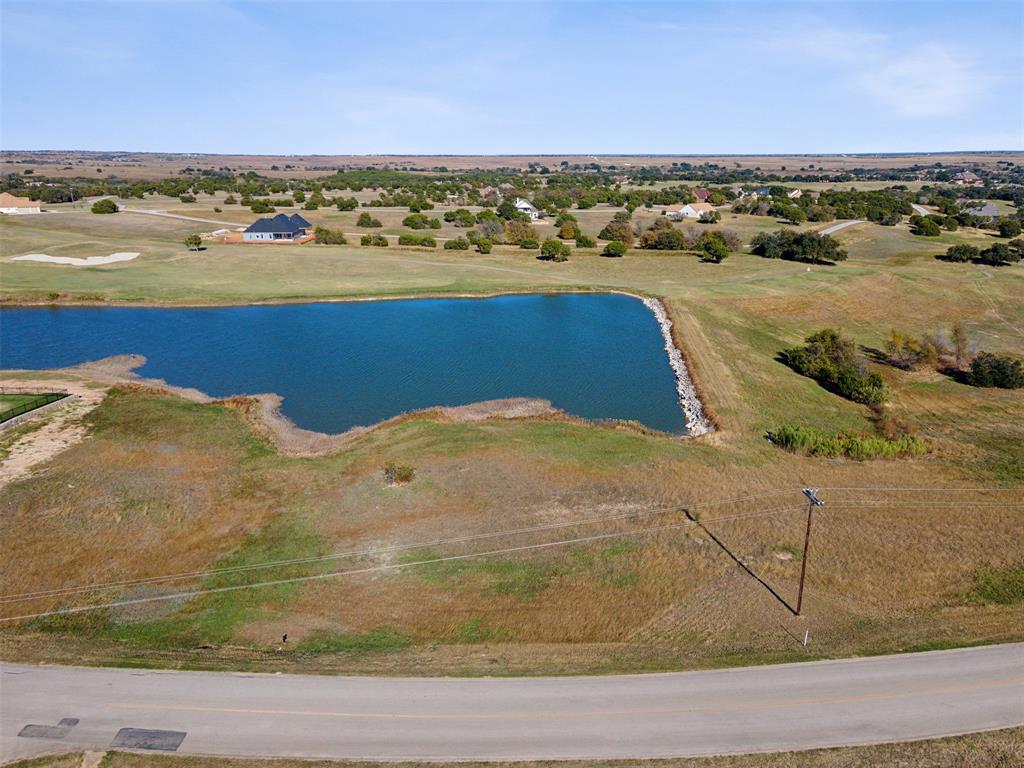 Welcome to this exceptional waterfront lot located in the exclusive gated community of The Retreat, offering views across the water of the lush, well-maintained golf course. With its larger size (est. lot and half), this prime parcel provides the perfect foundation to build your dream home or vacation retreat, offering great space for privacy and your ideal outdoor living. The Retreat is a sought-after community that has so much to offer. Enjoy access to an 18-hole Championship golf course, ideal for both casual and avid golfers (you receive 8 free complimentary rounds a year with your dues!). You have a club house, restaurant and pro shop, the perfect spot to unwind after a round of golf. For recreation, take advantage of TWO swimming pools, a Fitness Center, and Tennis-Pickle Ball Courts, catch and release fishing, parks and playgrounds, all within the community for your enjoyment. Whether you're looking to enjoy the outdoors, stay active, or simply relax in a tranquil setting, The Retreat provides everything you need for a luxurious lifestyle. Don't miss this rare opportunity to own a stunning waterfront lot with views of the golf course in one of the most desirable communities around. Schedule your showing today!