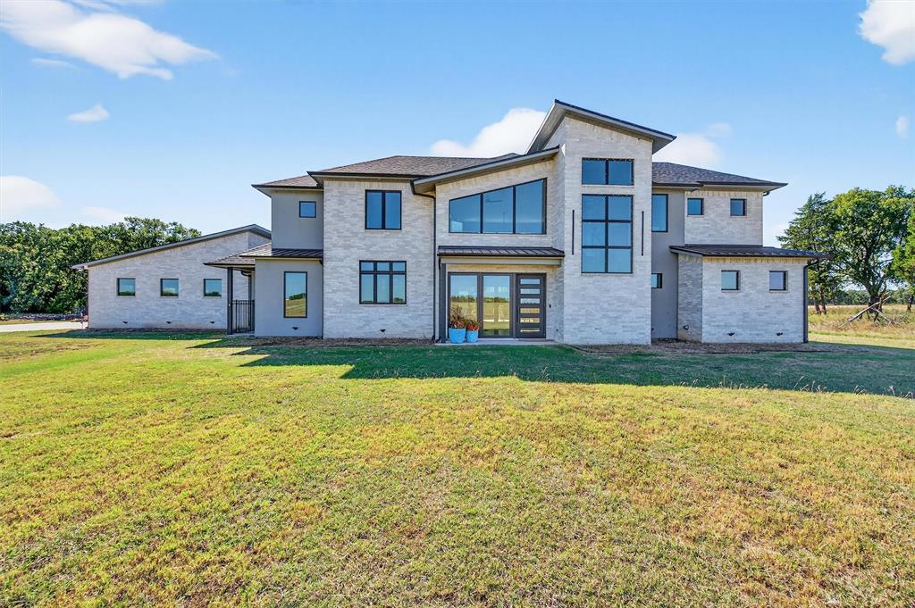 This 3-bedroom, 3.5-bath, 3,554 sf modern masterpiece and 94.955 acres of land present endless possibilities for buyers seeking a blend of sophistication and rural charm. Situated at the end of a quiet road with large neighbors, this property is one of the finest offerings in North Texas. The home features soaring ceilings in the kitchen and living area, oversized home office off the master suite with a striking stone fireplace, and beautiful polished concrete floors. The kitchen showcases a massive island with waterfall edges and room for casual dining, top-of-the line appliances, and tons of storage space, while the adjoining dining area abuts expansive windows, bringing the outside in. The downstairs master features separate vanities and walk-in closets, and a massive corner shower.  Beautifully crafted floating stairs lead past large windows to a childrens loft and two spacious upstairs bedrooms, each with a full bath and walk-in closet. The 3-car garage includes a storage closet, washer-dryer connections, and ample room for storage. The massive back porch overlooks magnificent oaks and the pond below, which attracts frequent visitors of deer and turkeys and serves as your gateway to the great outdoors. Situated at the end of a quiet road with large neighbors, the property borders Hagerman NWR for over ¾ mile, presenting an ultra-rare opportunity for exclusive access to world-class trophy whitetail deer and waterfowl hunting. Located near major highways and the projected North Dallas Tollway, the property is just over an hour from DFW Airport, 10 minutes from Whitesboro, and 20 minutes from Sherman, ensuring easy access to urban amenities while maintaining a peaceful retreat. This North Texas paradise is perfect for those who value luxury, privacy, and the great outdoors. Whether you’re envisioning a family estate, a working farm, a hunting retreat, a serene sanctuary, or all of the above in one package, this property delivers endless possibilities.