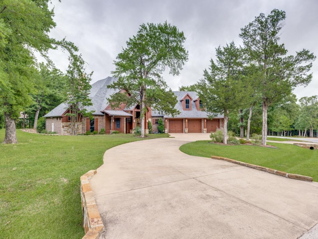 Beautifully appointed ranch-style home in the prestigious golf course lake community of Rock Creek, offering the perfect blend of luxury, comfort, and resort-style living. This spacious 4-bedroom residence features two private primary suites, ideal for multi-generational living or hosting guests in style.
Designed for entertaining, the open-concept floor plan flows seamlessly into the gourmet kitchen which is a chef’s dream with a gas cooktop, double ovens, pot filler, oversized island and abundant prep space. A charming wine grotto adds a unique touch for collectors and entertainers alike. Second level generous game room complete with a Brunswick pool table and seating for the movie enthusiast. A private balcony off the game room offers additional outdoor space to relax and unwind. Step outside off the family living to an incredible screened-in back patio featuring a fireplace, built-in grill with vent hood, wine-beverage refrigerator, and inviting living area for year-round enjoyment. The backyard is equally impressive with a putting green and a built-in fire pit area perfect for gathering under the stars. Offered fully furnished, this exceptional Lake Texoma home is move-in ready and provides a rare opportunity to enjoy upscale living in one of the area’s most sought-after lake and golf communities.