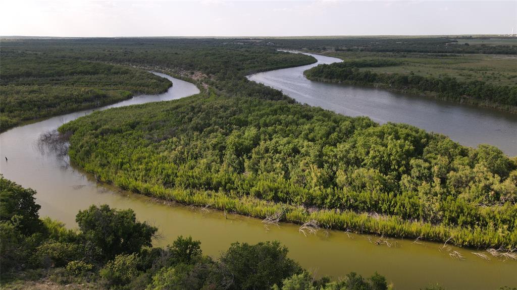 Horse Creek Ranch offers the optimum 1.4 miles of Concho River frontage available in Texas. It features a concrete ramp that easily ushers you and your boat straight into O.H. Ivie Lake, recently named the best fishing lake in America by Bassmaster Magazine and this Concho River branch offers the best fishing.

Horse Creek is a major tributary that runs through the middle of the 2,000+- acre ranch with several clear deep holes that hold water except during extreme dry spells. It provides preferred water for wildlife most of the year and attracts a large duck population each autumn.

When the lake is full, the ranch features several miles of lake front with multiple coves and inlets. At present, the lake is about half full, yet Horse Creek Ranch still offers prime angling not just for monster bass but also catfish that arrive via the rivers. The annual spring crappie spawn centers around the ranch's frontage.

Water is abundant year round with five water wells, each at about 150 feet that test at 20 to 40 GPM. An extensive network of water lines from three tall reservoirs provides water to concrete drinking stations. Spinner feeders, protein feeders and high stands are situated throughout the ranch. 

There has been no livestock on the ranch since May 2022.

Fencing is good with high fence, game proof fencing around three sides. The northern boundary is the Concho River and O.H. Ivie Lake. This property offers excellent privacy with a well maintained, private and fully deeded entry road. Interior fencing is good with old fence rows left in place to provide shelter for a substantial quail population. It is common to kick up 6 to 8 covey of quail on your drive around. 

Comfortable ranch house for overnight stays with a fancy equipment barn for your boat, tractor, or ATV's. 

Massive whitetail, abundant turkey, lots of quail, and ideal fishing on this phenomenal 2,000 acres! A 170 inch deer was taken in 2023.