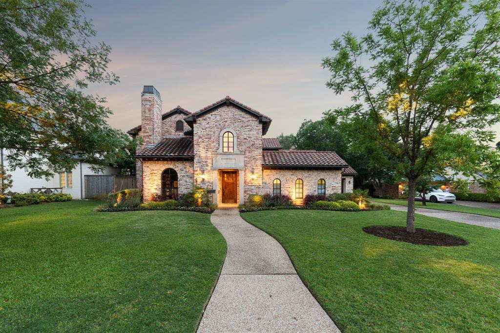 Situated in the charming Walnut Hill Ridge neighborhood & ideally located in Dallas’s premier Private School Corridor, this beautifully maintained home offers refined comfort, thoughtful design, and everyday livability. With a downstairs primary suite and an additional ensuite bedroom, the layout is perfect for guests or multigenerational needs. Warm hardwood floors flow through inviting living spaces, including a cozy library with built-ins and a fireplace. The heart of the home—a spacious, well-appointed kitchen—features stainless steel appliances, a built-in refrigerator, gas range, and double ovens, making it easy to cook and entertain in style. Natural light pours in through large windows that frame views of a serene, landscaped courtyard & sprawling backyard—crafted by Lawns of Dallas. The private yard offers a true retreat with a saltwater pool, grassy area, and large covered patio. Upstairs, you’ll find a large game room with built-ins, three additional bedrooms, and two full baths—providing space for work, play, and rest. A stylish concrete tile roof adds architectural character and lasting durability. Designated space for a future elevator. For a full list of upgrades, floorplans and disclosures, please see the transaction desk. Optional membership in the Walnut Ridge Neighborhood Association offers a welcoming sense of community. This is luxury that lives well—comfortable, elegant, and perfectly located.