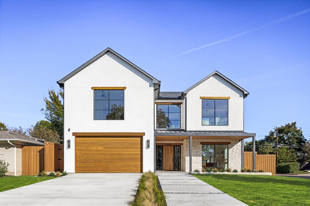 Welcome to 8604 Lockhaven Drive. Better experienced than described, this home raises the bar for Lake Highlands luxury living. Architecturally stunning and thoughtfully executed, this new construction blends artistry and precision in a way that few homes do. From the moment you arrive, the balance of materials offers a nod to both Texas craftsmanship and California design, with cedar siding, Austin white tumbled rock, and stucco set beneath a mix of composition and standing seam metal roofing. Inside, a custom oak front door opens to a space built around light, warmth, and flow. The craftsmanship speaks quietly through custom white oak cabinetry and architectural lines that frame every room. The kitchen offers a full Thermador suite and a hidden butler’s pantry with a Fisher & Paykel refrigerator. The living area is anchored by one of two Isokern fireplaces. Sonos audio moves with you through the home and a wired Ring system adds security and ease. Every comfort is integrated seamlessly, including 3 Ecobee-controlled HVAC systems and a built-in scent diffuser. The primary suite is its own destination, wrapped in soft light and finished with a Tadelakt bathroom that feels handcrafted and timeless. The closet brings practical indulgence with its own washer and dryer; one of two laundry setups. Even the details behind the walls reflect intent; 2x6 framing for superior insulation, closed-cell foam for energy efficiency, and Ram windows for quiet and clarity. The oversized epoxied garage includes space for storage or hobbies, while the covered patio features retractable bug screens. The nearly quarter acre lot provides space to breathe, play, and entertain. Conveniently located less than a mile from Lake Highlands Elementary and less than half a mile from KayCee Pool. Every feature here was chosen for purpose, not pretense. Here you’re not just buying a home; you’re stepping into a higher standard of living!