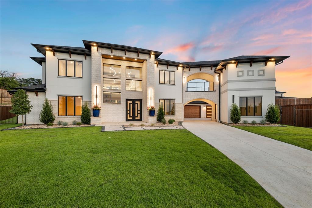 Step Into Luxury with a Custom Build by BC Homes! Epitomizing a Contemporary Mediterranean masterpiece, this stunning home rests on nearly an acre of land in the family friendly gated La Dorada subdivision of Aledo. Design your dream home by customizing this home or starting with a custom home design in Aledo’s newest Master Planned Community. The open concept layout invites guests and family alike with its stunning floating staircase and 20’ feature wall right as you enter the oversized wrought iron double doors. Be drawn into the thoughtfully designed floor plan with 20' ceilings in the Foyer and Great Room. Feel at home with a chef's dream Primary Kitchen adjacent to a well-equipped scullery. Retire after a long day to the privacy of the Primary Suite where the views out over the subdivision can be appreciated. The second story offers entertaining space for the whole family with a separate media and second game room. Enjoy your evenings on the open-air balcony where you can watch the sunset over the beautiful Aledo landscape. Bring your family to enjoy one of the highest rated public-school systems in DFW. Aledo ISD is breaking ground on their newest elementary school right in the Kelly Ranch subdivision, bringing the rare convenience of walkable, golf cart-friendly school days right to your doorstep. Right next door to the newest Tiger Woods Golf Course; Blue Jack Golf Course, opening later this year, La Dorada offers a 20,000 sq. ft. clubhouse with 4 pools, 4 tennis & 8 pickleball courts, a full gym, HIIT & yoga studios, a decadent restaurant, and a 250-seat ballroom. High design, luxury finishes, and community living. Your dream home is at your fingertips.