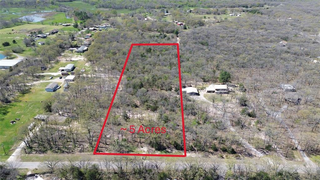 Beautiful, wooded 5 acres in the country, complete with a pond, the perfect setting for your new home. This unique opportunity offers a great head start with a water meter and septic tank already on site, plus electric available at the road. Seller is willing to split the property and sell just the front 2.50 acres.The property is currently Ag-exempt and fenced on three sides, providing both privacy and flexibility. Creek located in the back of the property. Tons of wildlife including deer.  Enjoy easy access to Hwy 276, making commutes simple while still embracing peaceful rural living. Buyer and buyer’s agent to verify all information. Seller believes septic tank is in good working order but is not warranted by the seller or EXIT Realty Pinnacle Group.