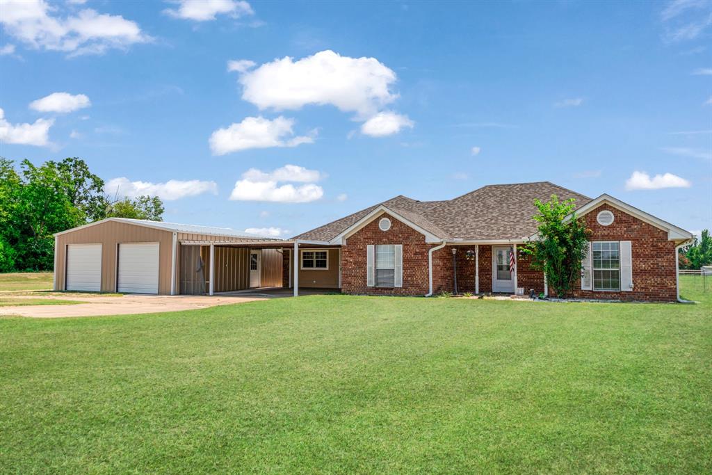 $10000 BUYER INCENTIVE!!! ONLY 5 MINUTES FROM PAT MAYSE LAKE! This home and all its amenities has something for everyone! There are multiple living and dining areas so that everyone can enjoy their own space, has a study or office, and a large game room with kitchenette or ideally set up for mother-in-law suite. The majority of this home was made over in 2023 adding additional square footage and a custom kitchen to the center of the home featuring beautiful cabinetry, granite countertops, work island, recent appliance package, washer, dryer, additional fridge & freezer, tv's and tv mounts will all convey to new owner! There are 2 primary bedrooms for added comfort for the extended family or guests to come and stay. Outside a 30x28 metal garage was added as well as a 30x40 metal shop w-loft and 40x20 lean-to for boat or RV storage that also includes 2 50-amp RV plugs and plumbed for a bath with 2 overhead doors. New Aerobic septic system and heating furnace in 2022, inground storm shelter. New roof added in 2023. The 3.7 acres of lush yard space has its own private pond surrounded by trees. This is truly a GEM for anyone needing a large home and a little space between you and your neighbors!