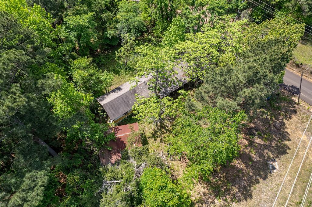 Just under 15 picturesque acres, this property is a true East Texas gem. Ideally located only half a mile from Lake Gladewater, 2 miles from downtown Gladewater (the intersection of Highways 80 and 271), and just a 20-minute drive to the amenities of Longview. Conveniently, it’s also only about 2 hours east of Dallas.

The property includes an existing mobile home with utilities in place (note: the home will not qualify for traditional mortgage financing), offering a ready-to-use homesite or a starting point for your vision. With endless potential, this tract is perfect for building, developing, or creating your own private retreat.

An electrical easement is noted on the survey. Enjoy the benefit of low property taxes thanks to a current timber exemption.

Whether you’re dreaming of a lake getaway, homestead, or investment opportunity, this beautiful, wooded acreage invites you to bring your imagination to life!  The land is located inside Gladewater city limit and ordinances in place require that, the existing trailer may stay, but once it is gone, it cannot be replaced. If replaced, a new home must be a either stick build or modular (per TDLR) and have a minimum of 1600sqft.

Cash buyers, land loans, and development loans are all viable options for this property.