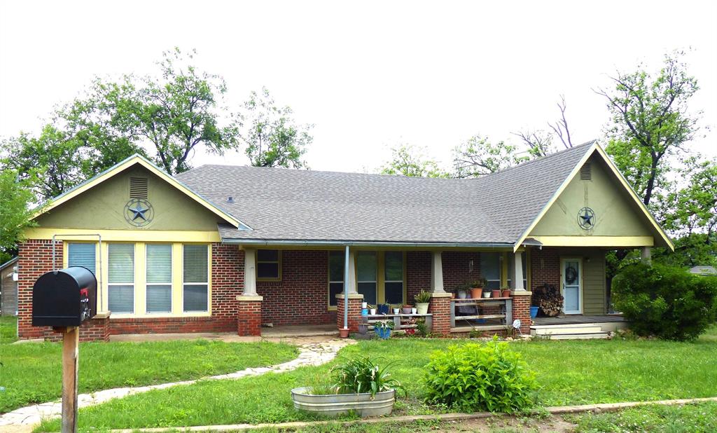 Very nice three bed three bath brick home on corner lot.  1932 sq ft of living space under central heat and air.  This home features hardwood floors, a woodburning fireplace, and a spacious bonus room. The bedrooms are all large.  The kitchen is equipped with a farm sink, stainless steel appliances, and custom King cabinets.  The dining room offers built in features.  The living room is more than spacious and includes a woodburning fireplace. There is a nice storage building as well as a workshop on the property.  This home also includes a sprinkler system.  This is all included on a corner lot with lots of room.