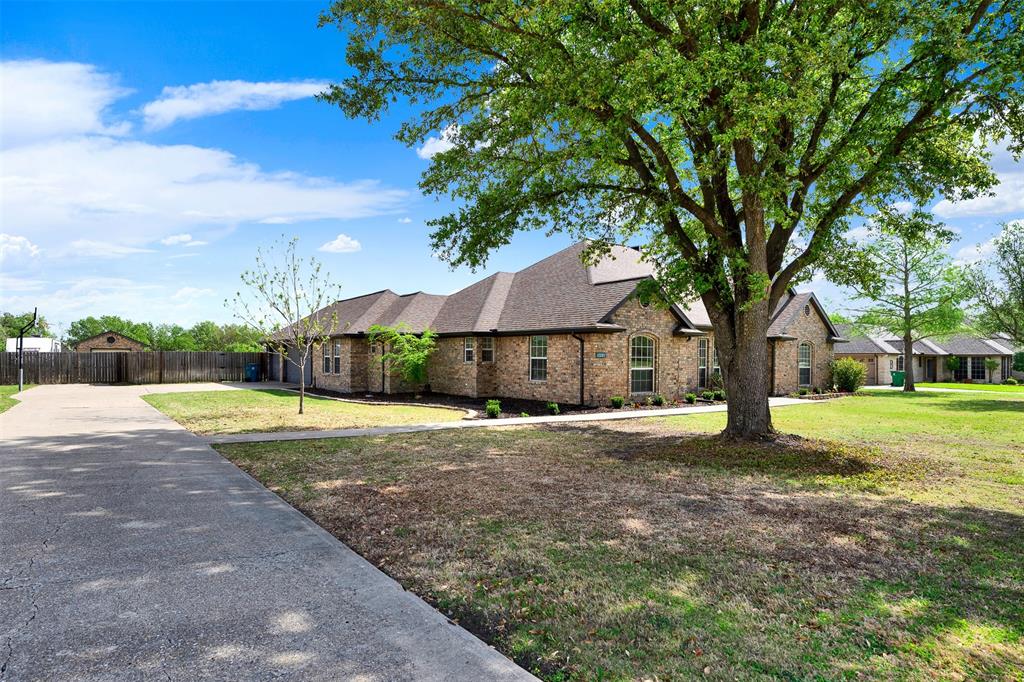 Beautifully updated and move in ready, this spacious home sits on a full acre in the highly sought-after gated community of Winners Circle. Thoughtfully renovated throughout, it features a fully updated kitchen and baths, new flooring, updated lighting, and a refreshed fireplace blending modern style with comfortable living.
The expansive kitchen is the heart of the home, offering a large center island, induction cooktop, deluxe pantry, and abundant prep space, all open to the oversized family room with a striking stone wood-burning fireplace, ideal for everyday living and entertaining.
The primary suite offers a true retreat with dual closets, a large walk-in shower, freestanding tub, and double vanities.
With 5 oversized bedrooms plus a dedicated study, this flexible floor plan accommodates a variety of needs. A private guest suite with private bath is perfect for visitors or multi-generational living, while the oversized fifth bedroom can easily function as a game room or media space.
Step outside to your private backyard oasis, complete with a swimming pool and waterfall feature, an expansive wood deck, and multiple patio areas designed for outdoor entertaining.  Children attend Forney ISD!
Additional highlights include a 3-car attached garage plus additional detached garage workshop, providing ample storage and workspace.
Located within the gated Winners Circle community, this property offers privacy, space, and modern updates, a rare opportunity to own a fully renovated home on acreage.