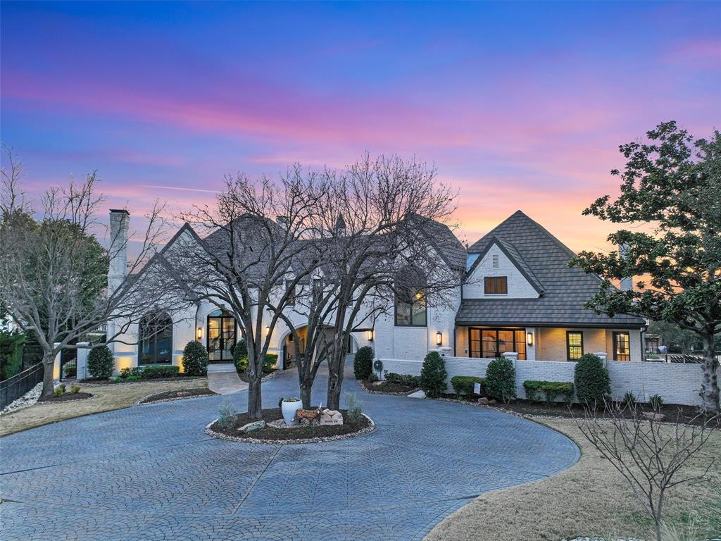 *Exquisite Luxury Living on the 17th Hole of Stonebriar*Welcome to your dream home nestled in the prestigious Stonebriar community, where elegance meets comfort in this sprawling 9,206 square foot estate. Complete with a MUTLIGENERATIONAL FULL one story GUEST HOUSE! Perfectly situated on the 17th hole, this spectacular property offers breathtaking views and an unparalleled lifestyle for both relaxation and entertainment. As you approach, a charming circular driveway guides you to the porte-cochere, framed by meticulously landscaped grounds enhanced with ambient lighting. Step inside to discover a grand entrance leading to a sophisticated living space designed with both style and functionality in mind. The heart of the home is an impressive chef’s kitchen featuring custom cabinetry, built-in stainless steel appliances, a double oven, and an indoor grill. The expansive island not only offers ample workspace but also serves as a gathering spot. The formal dining room seamlessly opens to a spacious living area adorned with a cozy fireplace and direct access to a serene patio, perfect for morning coffee with picturesque views. Retreat to the luxurious primary bedroom, complete with an expansive ensuite bathroom that boasts oversized walk-in closets and private access to the patio—an ideal sanctuary for relaxation. A thoughtfully designed guest suite with an ensuite bathroom is conveniently located on the main level. Venture upstairs to a second primary bedrm featuring its own ensuite bathrm, along w-viewing rm, great rm & a fourth bedrm w-yet another ensuite. This exceptional property also includes a luxurious guest house that comes fully equipped w-a kitchen, breakfast rm, dining rm, living rm, & bedroom w-ensuite bathroom and laundry room. Step outside to experience your personal paradise-a heated pool & spa with a meticulously designed outdoor kitchen, perfect for summer gatherings or serene evenings under the stars. Visit the Tour Link 128 photos for floor plans