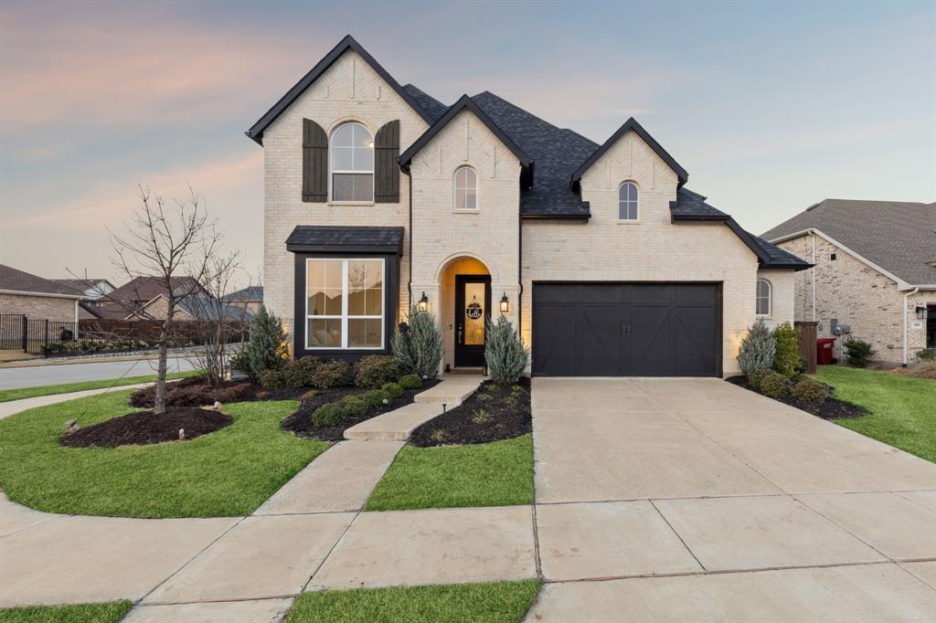 Welcome to Mantua, a distinguished master-planned community where resort-style amenities, scenic greenbelts, and an elevated sense of lifestyle come together to create one of North Texas’ most coveted addresses. Designed for both relaxation and connection, residents enjoy a private clubhouse, sparkling pool, and beautifully curated outdoor spaces that define effortless luxury living. Within this exceptional setting, discover 1812 McDougall Creek—an exquisitely appointed Highland Home that embodies sophistication, comfort, and timeless design. Perfectly positioned on a premier corner lot, this 5-bedroom, 3-bath residence offers 2,855 square feet of thoughtfully designed living space, enhanced by high-end upgrades and refined finishes throughout. A grand, light-filled foyer with soaring ceilings sets an unforgettable tone, flowing seamlessly into elegant entertaining spaces and a stunning open-concept living area anchored by a statement fireplace. Walls of windows bathe the home in natural light, creating an inviting yet elevated ambiance. At the heart of the home, the chef’s kitchen is both functional and striking—featuring an oversized island, double ovens, gas cooktop, designer vent hood, walk-in pantry, and a sunlit dining nook perfect for intimate mornings or lively gatherings. The main-level primary suite is a private sanctuary, offering a spa-inspired bath with dual vanities, upscale finishes, and a spacious walk-in closet designed for indulgent everyday living. Upstairs, a versatile game room provides the ideal retreat for entertainment and leisure. Outdoors, a private patio and expansive backyard invite peaceful evenings and effortless entertaining. Complemented by a 2.5-car garage and proximity to premier shopping, dining, and top-rated schools, this home offers both prestige and convenience. 1812 McDougall Creek is more than a home—it is a statement of lifestyle