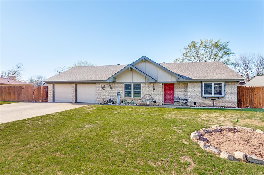 Single Story with Park-Like Backyard Only Minutes from Downtown Granbury! The charming exterior welcomes you into the formal dining room with wood pillar accents and tray ceiling details. The oversized living room has a wood-burning fireplace with a brick hearth and a custom mantle. The kitchen has granite counters, walnut cabinets, bar seating, a granite sink, a built-in microwave, and an electric range oven. The sunny breakfast room has a bay window accent overlooking the 24x15 covered patio. The primary ensuite has ceiling accents, a barn door entry into the bath with a granite dual-sink vanity, barnwood backsplash, and a large walk-in shower. The secondary beds are large with direct access to the full bath with a shower-tub combo. Step outside to a stunning, park-like backyard filled with manicured grass and plenty of space to relax, entertain, or simply enjoy the peaceful surroundings. Whether you’re looking for a full-time residence or a weekend retreat near the lake, this home offers the perfect blend of location, charm, and outdoor living. 2025 New HVAC & ductwork. 2025 New Stove & Microwave. 2024 New Septic. 2023 New AC. 2018 New Water Heater. The roof is 7 years new.