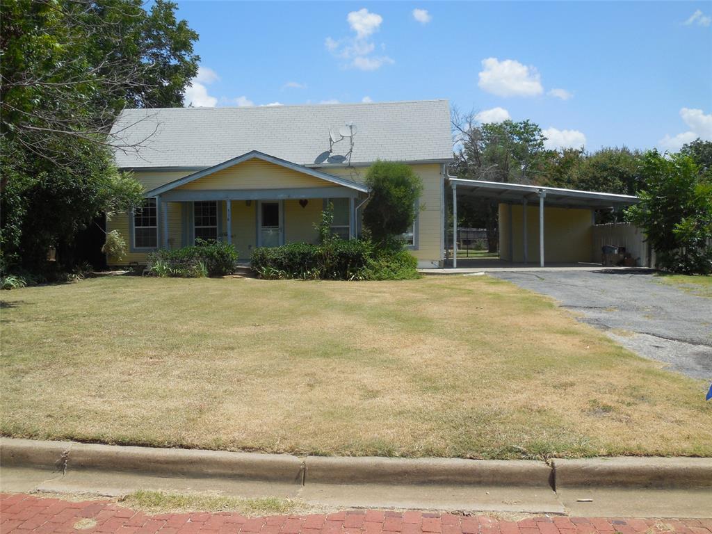 Located on a brick street this cute 2 bedroom, has 1 bath with tub and shower, and a large living and dining room. The kitchen has tile countertops and is connected to a large utility area. There are fans throughout the home with insulated windows, central heat and air, recent total wiring, and very well insulated ceiling and walls. The backyard is totally fenced with a wood privacy fence on 3 sides and a chain link fence in the front under the carport.  It has an attached 2 car carport with a storage room, workshop with electricity, and large covered patio area. The backyard is very nice and a great place to relax or entertain. It would be a great home for retirement, family, or rental with 2 lots and plenty of space.  Call today for your personal tour.