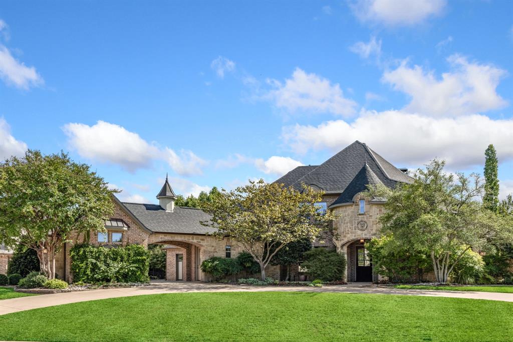 Welcome to this exquisite custom-built Carmen Homes masterpiece in the highly sought-after Country Club Village subdivision, zoned to the acclaimed Argyle Independent School District. A charming circular drive sets the stage for this beautifully crafted residence, where timeless elegance and modern comfort come together.

Inside, the thoughtfully designed floor plan showcases refined finishes and spacious living areas ideal for everyday living and entertaining. The gourmet kitchen is a chef’s dream, highlighted by a professional-grade six-burner gas cooktop, sleek cabinetry, designer surfaces, and a large center island that serves as the heart of the home.

The spa-inspired owner’s retreat offers a luxurious escape with a freestanding soaking tub, frameless glass shower, and custom walk-in closets designed for optimal organization. Each secondary bedroom is generously sized with en-suite or nearby baths, providing comfort and privacy for family and guests alike.

Outdoor living shines with an oversized backyard oasis featuring a sparkling pool, extended covered patio, and mature landscaping—perfect for relaxing evenings or hosting gatherings. Additional standout features include a private office with built-ins and a hidden closet, plus an upstairs game room complete with a wet bar for effortless entertaining.

This exceptional property presents a rare opportunity to enjoy elevated living in one of Argyle’s most desirable communities.
Buyer and Buyers Agent to verify all info contained in this listing Including room sizes, square footage, features, and schools.