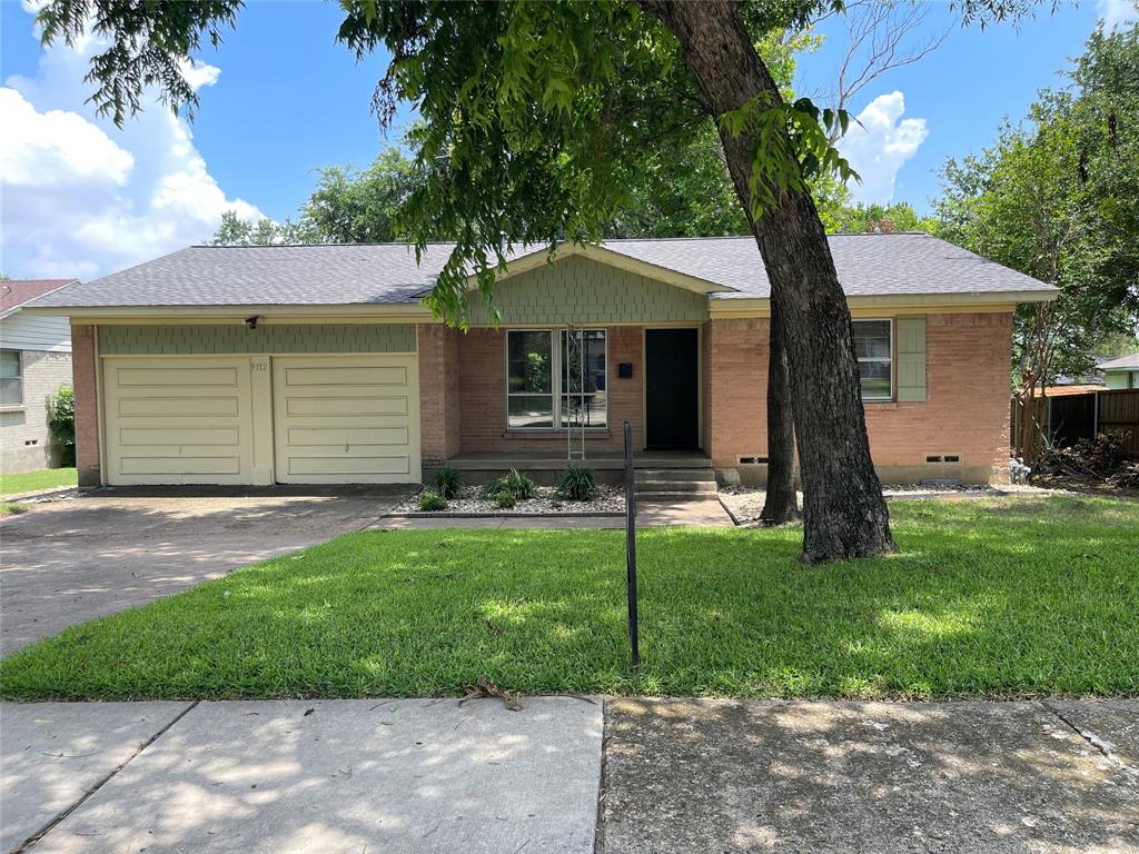 Charming vintage one-story on exceptionally LARGE LOT.  You'll need to see to appreciate the tall shade trees and lush lawn. This 3 bedroom, 2 bath home has ORIGINAL HARDWOOD FLOORS throughout and UPDATED KITCHEN AND BATHROOMS. Views to backyard are stunning from picture window in dining area and from kitchen. Spacious TWO-CAR GARAGE includes WORKBENCH, CABINETS & SHELVING for convenient storage. TWO STORAGE BUILDINGS, one metal and one wood, are located in the backyard. WOOD DECK and big concrete OPEN-AIR PATIO for enjoying the beautiful backyard. Tall shade trees and lush lawn make this spot a backyard paradise. Northwood Neighborhood is conveniently situated near Greenville Avenue between Royal Lane and Forest Lane. Quick access to highways 75 or 635. Commute to downtown is also easy. Close to restaurants and shopping. Located in the city of Dallas, this home is ZONED FOR RICHARDSON ISD.