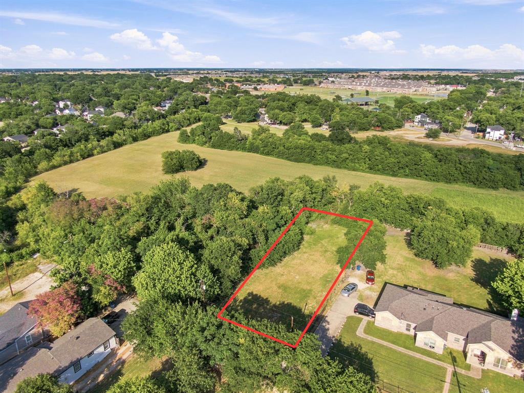 Rare find close to downtown Waxahachie: a .38 acre lot at the end of a quiet dead-end street, ready for you to build on. This one's flat, cleared, and line with mature trees that give it a settled, established feel you don't often get with new construction lots. Utilities are available at the street, which means less guesswork and a smoother start once you're ready to break ground.

The location is what makes this one worth a look. You're minutes from downtown Waxahachie's square, with its restaurants, shops, and the small-town feel that keeps drawing people to this side of Ellis County. Being tucked at the end of a dead-end street means low traffic and a quieter setting, while still putting you close to everything downtown has to offer.

This is a bring-your-own-builder lot, so you have full control over the home you put here. Whether you've already got a builder lined up or you're still in the planning stages, this gives you a real head start. 

If you've been looking for a spot to build your own home instead of buying someone else's, this is worth walking. Quiet street, trees at the back, close to downtown, and ready to go.