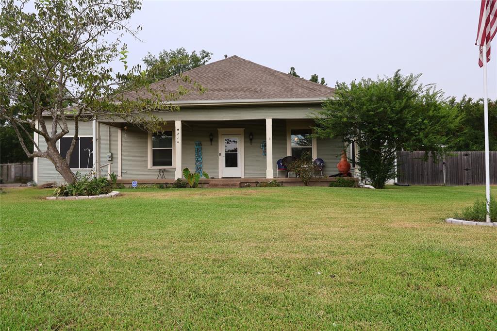 Charming Downtown Alba Home with Historic Character & Modern Comforts

Welcome to this spacious and beautifully updated home in the heart of downtown Alba. Blending early 1900s charm with modern convenience, this property features soaring ceilings, oversized trim, and a generous front porch perfect for relaxing evenings.

Inside, you'll find 3–4 bedrooms and 2 full bathrooms, plus a flexible floor plan that includes a large utility room, mudroom, formal dining area, and a bonus den or sunroom. The kitchen has been thoughtfully updated with stainless steel appliances, a breakfast bar, coffee station, and a full-sized pantry—ideal for both everyday living and entertaining.

Enjoy easy-care laminate wood flooring throughout, abundant storage, and a recently replaced roof for added peace of mind. A storm shelter provides extra security during severe weather, offering protection for your family year-round.

Step outside to a spacious backyard with two large storage buildings and a producing persimmon tree—perfect for gardeners or hobbyists.

Located in the heart of East Texas, this home offers small-town charm with excellent access to Lake Fork, just minutes away. Conveniently situated 100 miles from DFW, 45 minutes from Tyler, and 25 minutes to I-20.