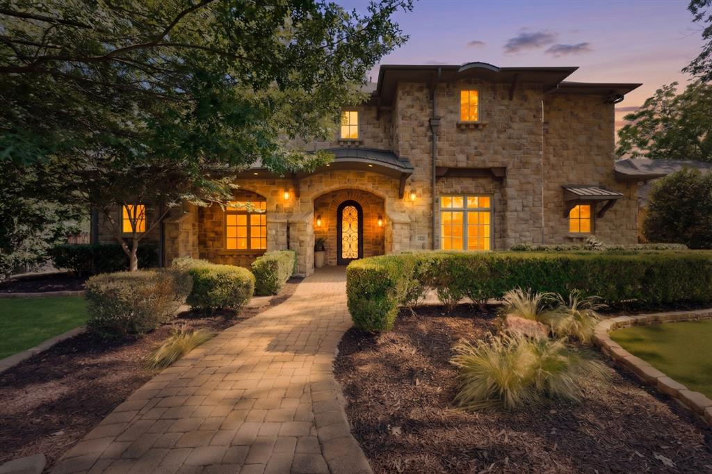 Nestled behind mature privacy hedges, this custom Preston Hollow estate offers ideal spaces for entertaining and daily living. Stunning finish-out features thoughtfully curated living spaces throughout, rich hardwoods, detailed vaulted beams, 2 living areas down with fireplaces, a gourmet kitchen with Wolf range, dual sinks, Miele coffee system, icemaker, wine fridge, pantry and oversized island opening to the family room & breakfast area. First floor offers private primary suite with generous custom closet, formal living, elegant dining room, dedicated office and a well-appointed guest suite. The 2nd floor features 3 ensuite bedrooms, a fitness room, spacious game room & media room. Exceptional outdoor turfed living spaces include a serene courtyard, heated pool with connected spa, outdoor kitchen, separate fenced play yard, perimeter mosquito system, covered private patio with outdoor fireplace for year-round enjoyment. New roof May 2026. So much to love!