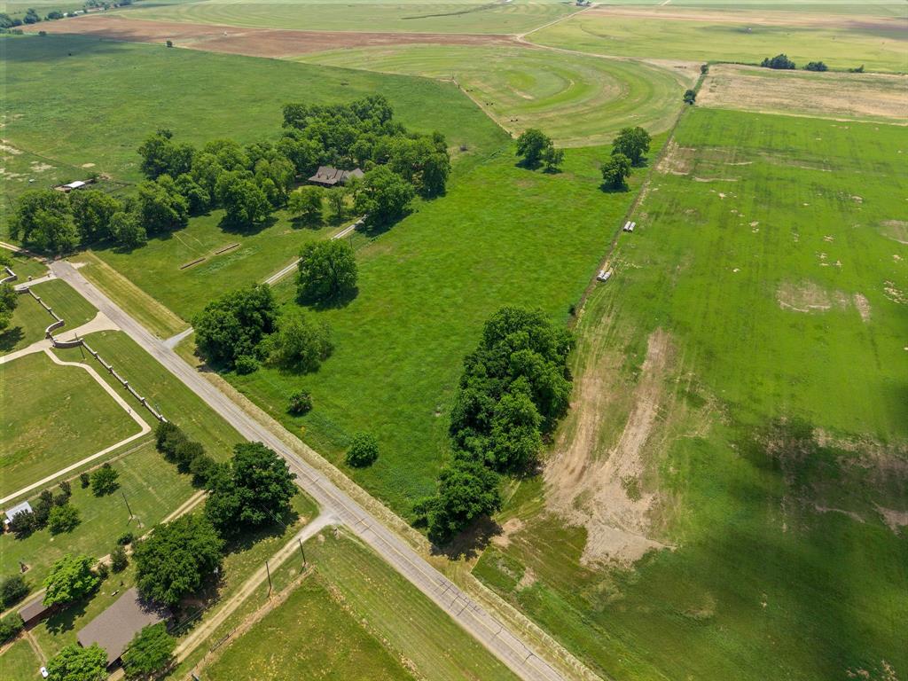 Discover the perfect blend of peaceful country living and future potential with this beautiful 7.5-acre tract on TBD FM 3221 in Bonham. Ideal for agricultural use, a private homestead, or building your dream home, this property offers rich, deep Mulberry bottom land well known for its exceptional growing conditions. The fertile soil has supported Bermuda grass, alfalfa, vegetable gardens, fruit trees, and even vineyards, making it a rare opportunity for those seeking productive land with versatility and charm.

Located near the Red River and surrounded by newer homes, the property provides a peaceful rural setting while still offering the comfort of an established and growing area. With restrictions prohibiting mobile homes and campers, the surrounding environment maintains a clean, attractive feel that protects long-term value. Whether you envision a hobby farm, country retreat, or custom home site, this property offers endless possibilities in a beautiful North Texas setting.