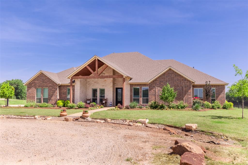 WOW! The North Texas Retreat you've been waiting for! This stunning property has something for almost everyone! First, the property sprawls over 90 acres located between Alvord and Decatur and has a nice stock tank, areas that have been cleaned up and manicured for presentation, as well as heavier tree coverage heading toward the back of the property. The property features an absolutely gorgeous Schedcik custom home that was completed in 2021-2022. The home stuns with just over 3900 sq ft, large picture windows overlooking a massive back patio and a 12 foot deep pool that has features such as a grotto, waterfall, attached hot tub, and swim up table! The home is a 3 bed each with full ensuite bath, wide hallways and doorways, workout room, Media room with a wet bar and full bathroom next to it, And could be used as a 4th bedroom if needed, well appointed high end finishes throughout such as hardwood floors, solid doors, storm room built in, butler pantry with grocery door from the garage and commercial grade kitchen appliances! The appliances are a 6 burner gas cook top, convection oven with warming drawer, built in refrigerator, dishwasher, and microwave in the island. If you don't want the pool company in the house, the separate she shed or pool house has a small kitchenette area bathroom, or a place to get out of the sun. There is no shortage of space on this property. The home has oversized 3 car garage that will fit a 1 ton truck and full size SUV comfortably, a detached shop has roll up doors for additional storage for mowers or farm implements. If you have frequent extended stay guests, the shop also features its own living quarters with a 1 bed 1 bath apartment with living room, kitchen and its own covered patio to enjoy the morning coffee! This property has so much to offer. Ample acreage with plenty of room for activities, a phenomenal place to entertain friends and family, run livestock, or just sit back and relax by the pool at your home on the range!