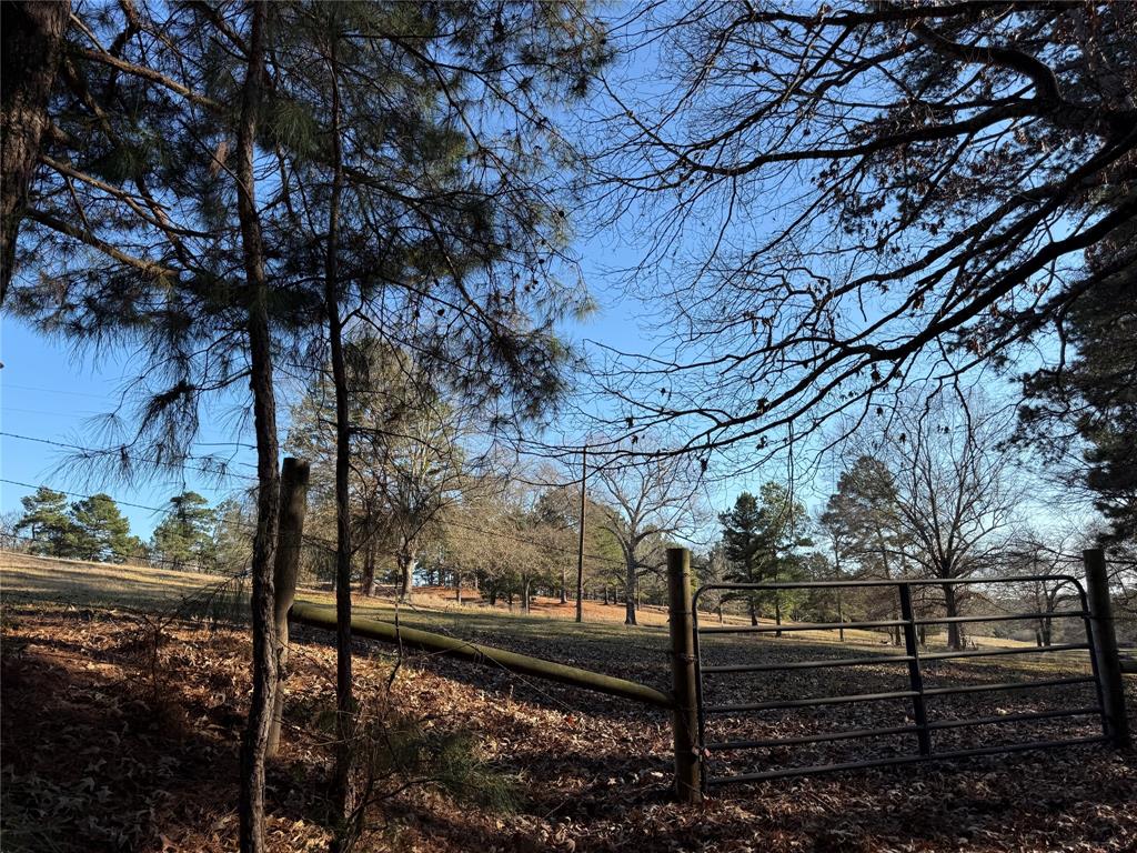 This property has view of lake on the property behind this land. 4-5 acres on elevated slope. Creek runs on West side of the property. 
One and half acres in flood area. Property is great for a home with a pond, this property will have an easement to access to FM 2015
across the two adjoining tracts that are for sale. A 5.564 acres for $18,000 per acre and 7.564 acres for $15,000 per acre and this 
property for $13,000 per acre. Each property is listed separately. All 3 tracts are excellent for one big family to build several homes.