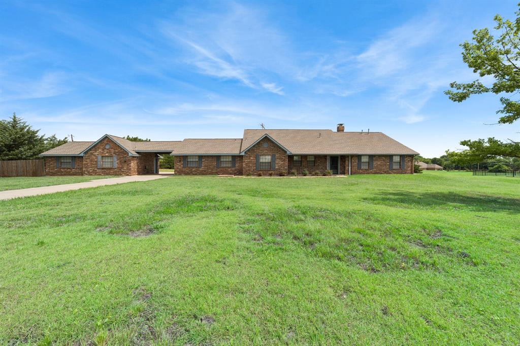 This meticulously maintained, one-owner gem nestled in the highly sought-after Lovejoy ISD is truly one of a kind. Offering 4 bedrooms and 2.5 baths, this thoughtfully designed home blends comfort, functionality, and lifestyle in one incredible package.
The heart of the home features an open-concept kitchen with a breakfast nook flowing seamlessly into the warm and inviting living room, complete with custom built-ins, a cozy fireplace, and pre-wired TV mount above the mantle — perfect for movie nights and game days. Built-in speaker wiring and exterior holiday light wiring add those special finishing touches that set this home apart.
Just off the living area, a versatile bonus room serves perfectly as a sunroom, home gym, or playroom — the possibilities are endless.
Step outside to your own private retreat featuring a large covered patio ideal for entertaining, plus an expansive concrete pad perfect for extra parking, basketball, or outdoor games. The oversized 2-car attached garage is complemented by an impressive porte-cochère with an additional 2-car garage, a half bath, and a dedicated workshop area.
Sitting on a beautiful 2-acre lot with no HOA, this property is ready for your horses, a future pool, or whatever your heart desires. A large barn with electricity and water offers excellent storage or easy conversion to a horse setup. Enjoy the freedom of country living while remaining close to Lake Lavon,  the Trinity Trail, shopping and schools.
This one checks every box — don't miss it!