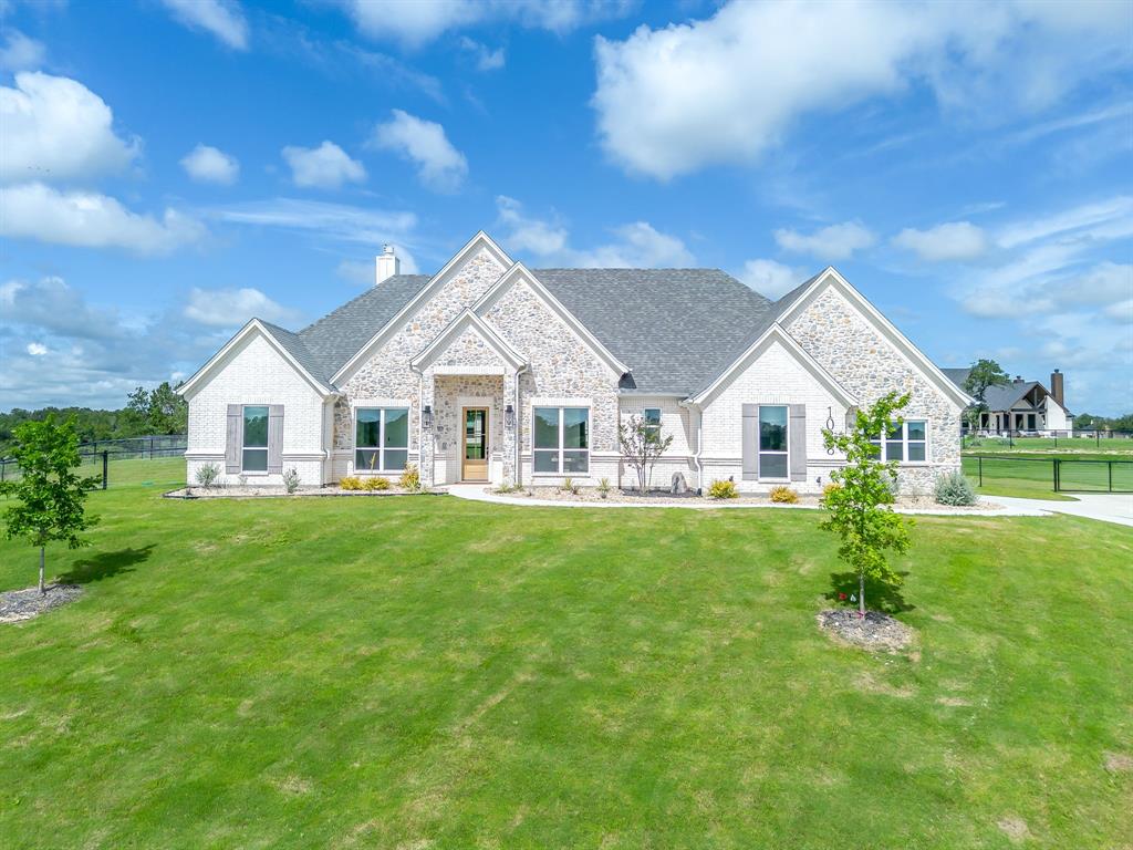 Welcome to a Byron G Custom Home! This stunning new construction home invites you in with an open-concept floor plan and impressive 8-foot doors throughout. Perfectly thought-out finish-outs and upgrades create a luxurious yet comfortable feel. Porcelain wood-look tile flows throughout the main living areas, complemented by designer tile selections in the bathrooms, showcasing the carefully curated design choices found throughout the home. The kitchen is truly a must-see, featuring upgraded custom details including a built-in microwave drawer, electric range, pot filler, and a stylish coffee and wine bar conveniently located across from a large walk-in pantry. Your primary suite offers a clean, sophisticated retreat highlighted by a beautiful freestanding tub. The attached spa-like bath features organic, natural finishes, a separate walk-in shower with seamless glass, dual vanities, and TWO oversized custom walk-in closets. Step outside to take in the stunning Texas horizon views and breathtaking sunsets. The backyard is fully fenced with a no-climb 4-foot fence, 12-foot driveway gate, 4-foot man gate, and the driveway includes a hammerhead extension for convenient turnaround access. Additional upgrades include full spray foam insulation throughout the home and garage, plus epoxy-coated garage floors. The builder provides a 1-Year Workmanship Warranty, 2-Year Systems Warranty, 10-Year Structural Warranty, and 10-Year Foundation Warranty, along with a Warranty Services Plan for the first year. You truly have to see this one in person—your dream home awaits.