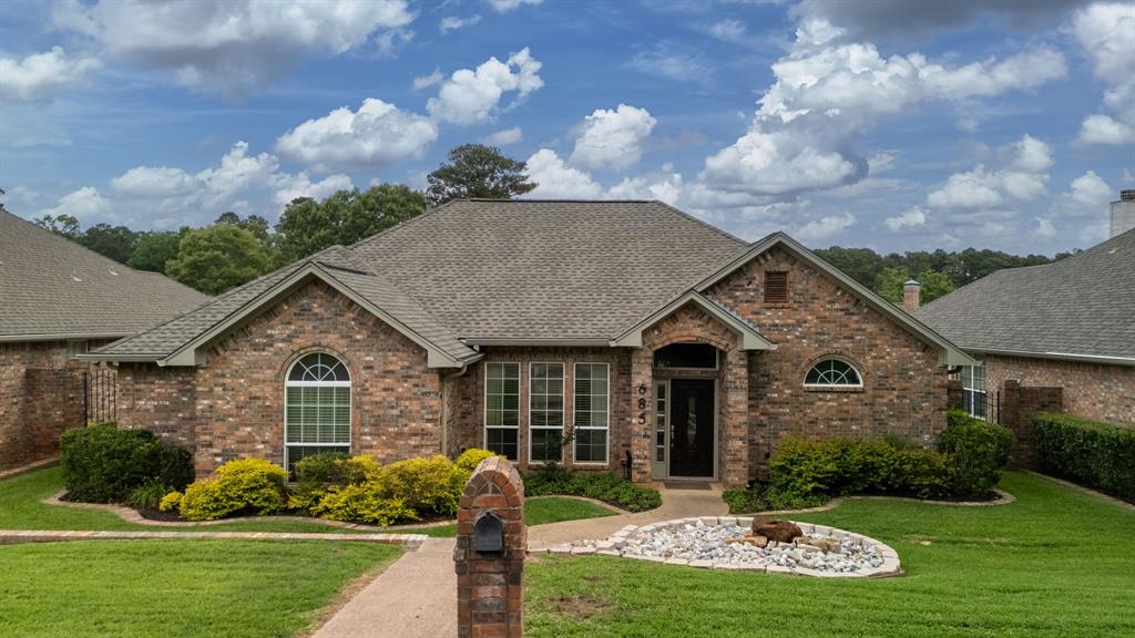 Welcome home to 685 Bunker Drive in beautiful Bullard, Texas! This stunning 3 bedroom, 2 bathroom home is truly move-in ready and offers the perfect blend of comfort, style, and thoughtful updates throughout.  Step inside and immediately notice the abundance of natural light that fills the home, creating a bright and airy feel throughout. The spacious foyer opens into an elegant formal dining room featuring extensive crown molding, making it the perfect space for holiday gatherings, dinner parties, or everyday family meals. The large living room is both cozy and functional with a beautiful corner fireplace accented by tile surround and a substantial mantle that serves as the focal point of the space. The open layout creates an effortless flow for both entertaining and daily living. The kitchen has been tastefully remodeled and is sure to impress with painted cabinetry, granite countertops, updated appliances, and a gas range perfect for cooking enthusiasts. Offering abundant workspace and storage, the kitchen seamlessly connects to both the living area and breakfast nook, making it the true heart of the home. The oversized primary suite provides a peaceful retreat with plentiful natural light and ample space to unwind at the end of the day. The remodeled primary bathroom features updated finishes, a thoughtfully designed oversized walk-in shower, and direct access to the spacious walk-in closet for added convenience. Two additional bedrooms offer flexibility for family, guests, or a home office setup. Additional updates completed by the current owners include flooring, paint, kitchen improvements, and bathroom renovations, allowing the next owner to move right in and enjoy. Outside you will find a large covered patio with electric shade, fenced yard and gorgeous landscaping.  Neutral color palettes throughout the home make decorating effortless and timeless. Conveniently located with a Tyler address and highly sought-after Whitehouse ISD