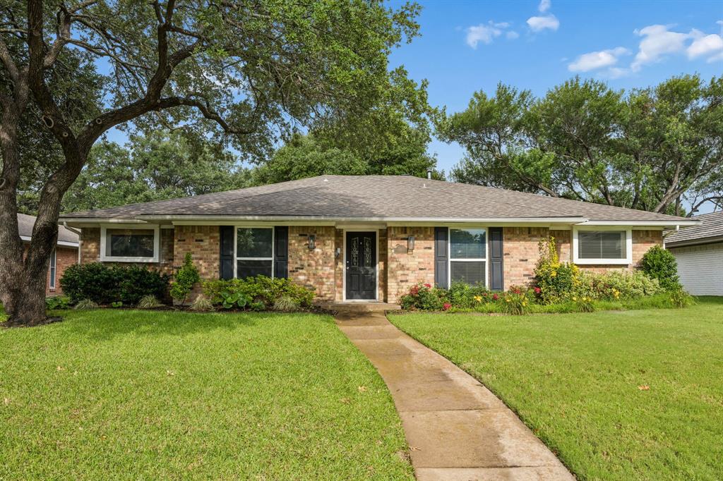Situated in the desirable Prestonwood neighborhood and zoned to RISD, this beautifully maintained 4-bedroom, 3-bathroom home offers timeless character, spacious living areas, and inviting outdoor spaces. Charming curb appeal and mature landscaping create a warm welcome, while rich wood flooring throughout the main living spaces adds warmth and elegance throughout the home.

Inside, two spacious living areas and a dedicated dining room provide a flexible and functional layout. The main living room features ceiling beams and a striking stone fireplace, creating a cozy focal point. The kitchen is thoughtfully designed with granite countertops, stainless steel appliances, abundant cabinetry, and a charming breakfast nook complete with built-ins for additional storage.

The primary suite offers a relaxing retreat with an ensuite bathroom featuring dual sinks, a soaking tub, separate walk-in shower, and a spacious walk-in closet with custom built-ins. Three additional bedrooms and two full bathrooms provide plenty of room for family, guests, or a home office setup.

Step outside to enjoy an exceptional backyard designed for entertaining and relaxation. A covered patio and deck shaded by a pergola create the perfect outdoor gathering space, while the outdoor bar adds convenience for hosting. The backyard also features a private putting green installed in 2022, offering a unique space to unwind and enjoy outdoor living at home. Landscaping improvements completed in 2024 enhance both the front and backyard.

Additional updates include a new water heater and furnace installed in 2023, PVC plumbing, and numerous thoughtful improvements throughout the home. Combining comfortable living spaces, quality updates, and a sought-after Prestonwood location, this home offers an exceptional opportunity in one of North Dallas’ most desirable neighborhoods.