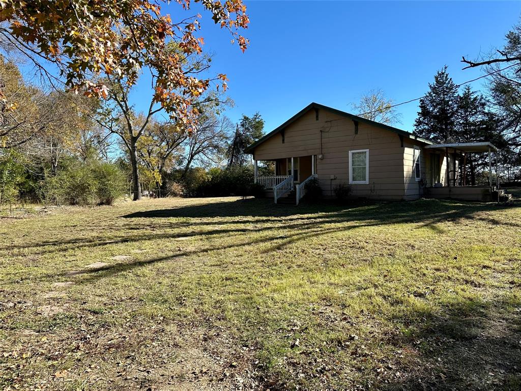 The home sits on one acre in Canton ISD with 2 bedrooms, 1 full bath, and a large kitchen. The shop is 864 square feet with spray foam insulation, 2 separate bays, remote garage doors and an 8x36 foot overhang. The right garage bay was used as a gameroom and has tongue and groove pine on the walls. There is a well and an aerobic sewer system. The property is in the county.