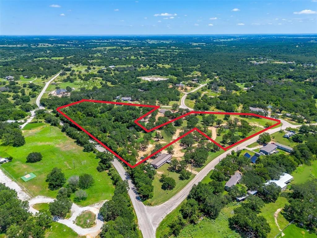 Welcome to 410 Wild Hill Oak Drive, a remarkable 5.66-acre property adorned with mature trees and lush, natural foliage. Meandering dirt roads guide you through the land to a peaceful watering tank—ideal for fishing or supporting livestock. Tucked away for privacy yet thoughtfully improved, this secluded property offers the perfect canvas to build your dream home. A 60' x 40' concrete pad is already in place, ready for construction. The land may be subdivided into two-acre tracts and is equipped with an existing water well and electricity. With convenient access from two paved county roads, this property blends tranquility, opportunity, and accessibility in one exceptional offering.
See transaction desk for documents.