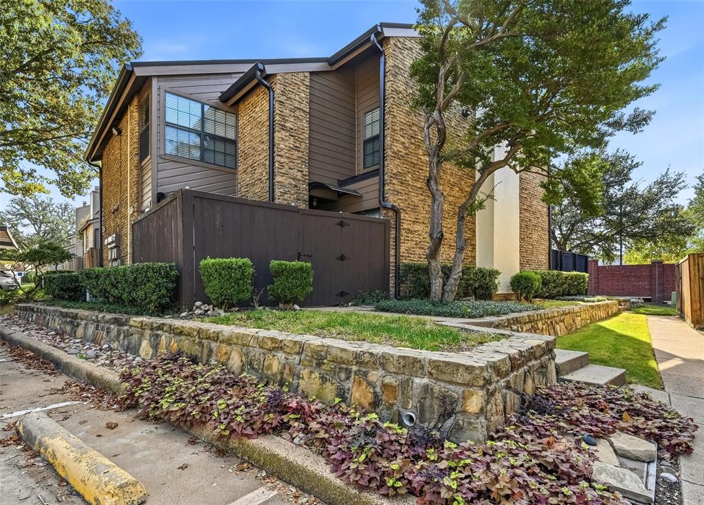 Welcome to Richardson Crossing. This condominium features two generously sized upstairs bedrooms, a dining area, a spacious living area with a cozy fireplace, an updated kitchen with quartz countertops, a recent Anderson sliding glass door with a transferable warranty, new carpeting on the stairs, and luxury vinyl plank flooring. The upstairs bathroom has been recently renovated and includes a tub with tile surround and includes a transferable warranty. This corner unit benefits from ample natural light due to two sliding glass doors leading to the private patio and numerous windows. The condominium is conveniently located, a short distance from I-75 and close to PGBT and UTD, with numerous restaurants nearby. Covered parking space is designated as #50, with additional parking available in front of the unit.