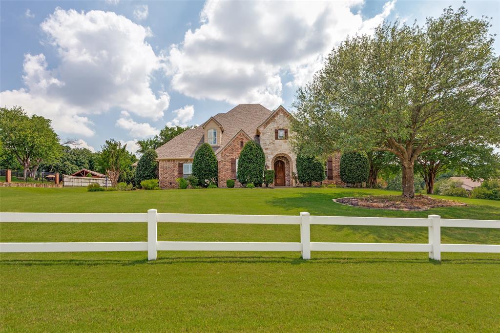 Luxury home in desirable Willow Creek Ranch Estates! *Joshua Schools!* This home has it all--1.3 acre estate with tree and a private feel. 
FOUR generous bedrooms, FOUR bathrooms, *Office or study, *Game Room with mini fridge,* Media Room, *Formal Dining, and a *3 Car Garage.  *Class 4 Impact Rated Roof with Gutters in 2024.  You've got to see the MEDIA room--the leather stadium seating can stay. Make yourself at home in the spacious living area with its gas log fireplace, built-ins, and beautiful flooring. Indulge your inner chef in the cook's kitchen with beautiful gas range, center island, and pantry. Tankless water heater for the primary bedroom-NEVER run out of hot water. *And then you step outside...imagine summer fun in the diving pool, hot tub, and covered patios. Pool heater new in 2025. *Pool House has a kitchenette, serving bar, and a half bath. Can you see your family enjoying evenings by the gas plumbed fire pit? Whole home wired wifi. Fiber Optic gigabit internet. Denon-HEOS Home and Outdoor Audio throughout house and patio. *Safe Room in secondary bedroom wired for landline phone. *Gun Safe. Wrought Iron fencing in 2025. Dog run. Fresh carpet. Red & White custom cut holiday lights. 
Beautiful private lot.
