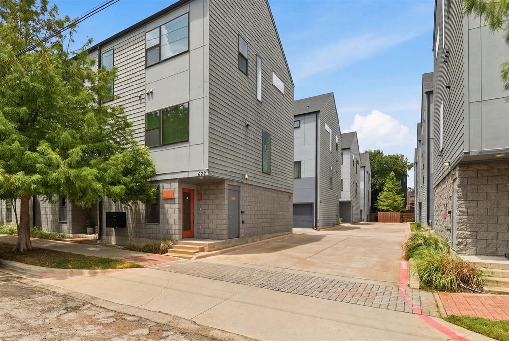 Live steps from the Bishop Arts District’s best coffee shops, restaurants, boutiques, yoga studios, and live music, yet tucked inside a quiet, private corner unit within a community of just 24 homes that feels worlds away from the bustle. This beautifully designed condo delivers walkability, modern comfort, and exceptional value without ever needing to get in your car.

This home blends clean, contemporary style with thoughtful functionality. The main level welcomes you with soaring ceilings and oversized windows that fill the space with abundant natural light, highlighting the open-concept living area and sleek modern kitchen with stainless steel appliances and a stylish tile backsplash. Gleaming rich hardwood floors and a seamless layout make this floor ideal for entertaining or unwinding after a night out. Meticulously maintained and completely move-in ready, this home offers a turnkey opportunity to enjoy one of Dallas's most vibrant and walkable neighborhoods.