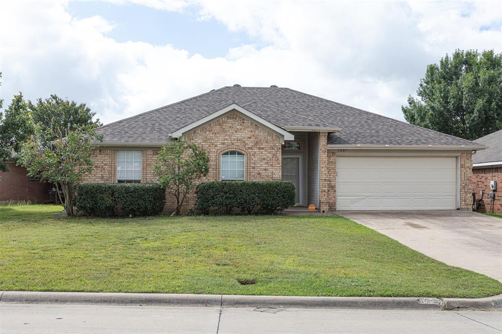 Welcome home to this well-maintained 4-bedroom, 2-bath property in the established Country Meadows neighborhood of Mansfield. Offering over 2,000 square feet, the flexible split-bedroom floor plan provides plenty of space. The oversized living room features a cozy wood-burning fireplace and opens to a spacious kitchen complete with a center island, and a sunny dining area. The private primary suite includes dual vanities, a garden tub, separate shower, and a generous walk-in closet. Step outside to enjoy the covered patio and backyard, perfect for weekend cookouts or relaxing evenings at home. Additional features include a dedicated utility room with built-in shelving, and a two-car garage. Conveniently located near shopping, dining, parks, and major commuter routes, this home offers the comfort of an established neighborhood with easy access to everything Mansfield-DFW has to offer.