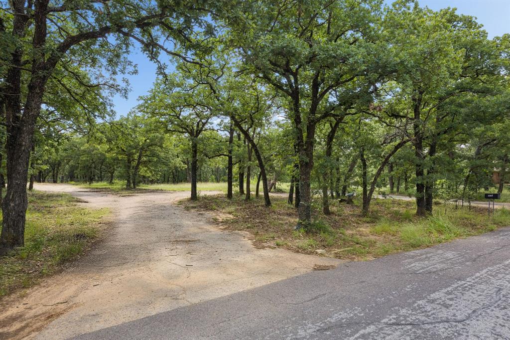 A RARE OPPORTUNITY TO CREATE YOUR DREAM ESTATE!!!  Discover an exceptional 4+ acre estate lot nestled in the heart of Highly Desirable North Keller. This breathtaking property features gently rolling terrain, towering mature trees, and a picturesque setting that offers the perfect blend of privacy, tranquility, and natural beauty. Heavily wooded and tucked away on a peaceful cul-de-sac, this horse-friendly parcel provides an extraordinary canvas to design and build the custom estate you've always envisioned.  Bring your own Builder and build on your timeline, there is NO HOA and no required timeframe to begin construction, offering unparalleled flexibility and freedom. Whether you dream of a luxurious private retreat, an equestrian estate, or a family compound, this remarkable property is ready to bring your vision to life.  Ideally located just moments from Westlake, Vaquero, and Southlake, you'll enjoy convenient access to Dallas, Fort Worth, major highways, DFW International Airport, and leading corporate campuses. Families will appreciate access to the highly acclaimed Keller ISD, consistently recognized among the area's top-rated school districts.  A survey is available. Opportunities to acquire a parcel of this size, beauty, and location are exceptionally rare. Experience the serenity of country-style living with all the conveniences of the Metroplex just minutes away.  Don't miss this truly one-of-a-kind opportunity to create the estate lifestyle you've always imagined!!!