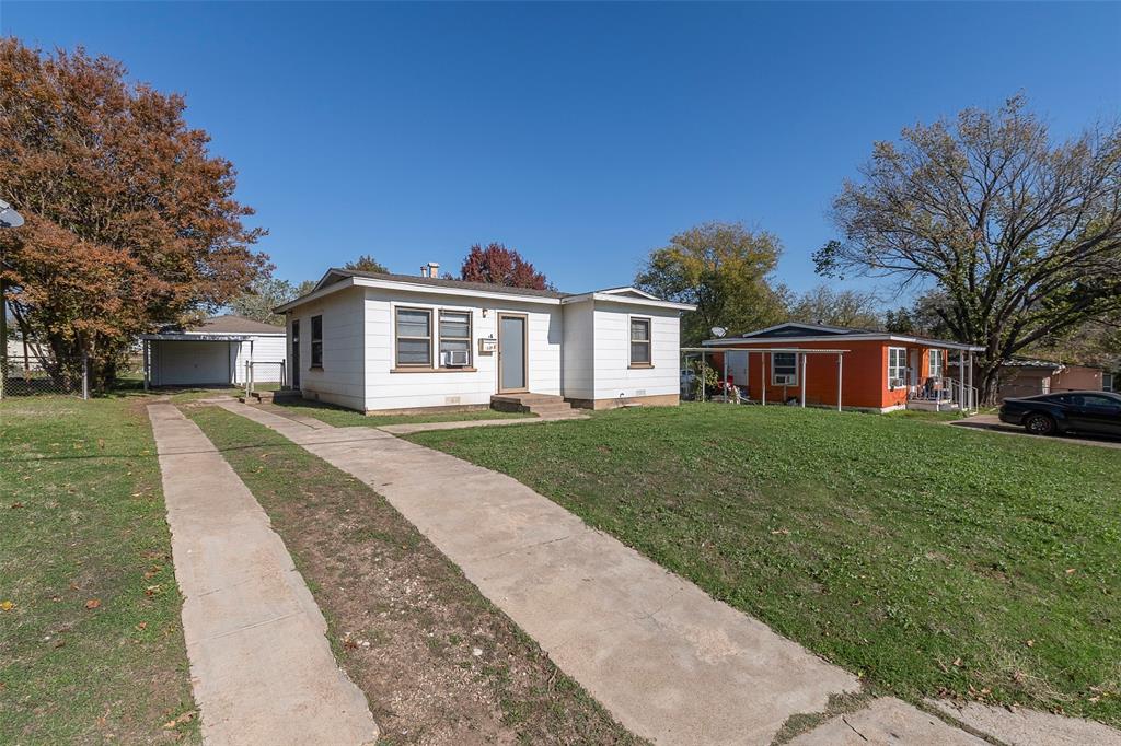 Welcome to this adorable 2 bedroom 1 bath home on a generous sized lot! All original hardwood flooring throughout the living room, hall and both bedrooms! Interior laundry hookups. Huge hall closet! Sturdy metal carport attached to a 440 square foot garage on a concrete pad. Convenient to I35, restaurants, grocery stores, the Stockyards and all that downtown Fort Worth has to offer. Property sold as-is and will need some TLC. Don’t let this property get away! Schedule a tour today!