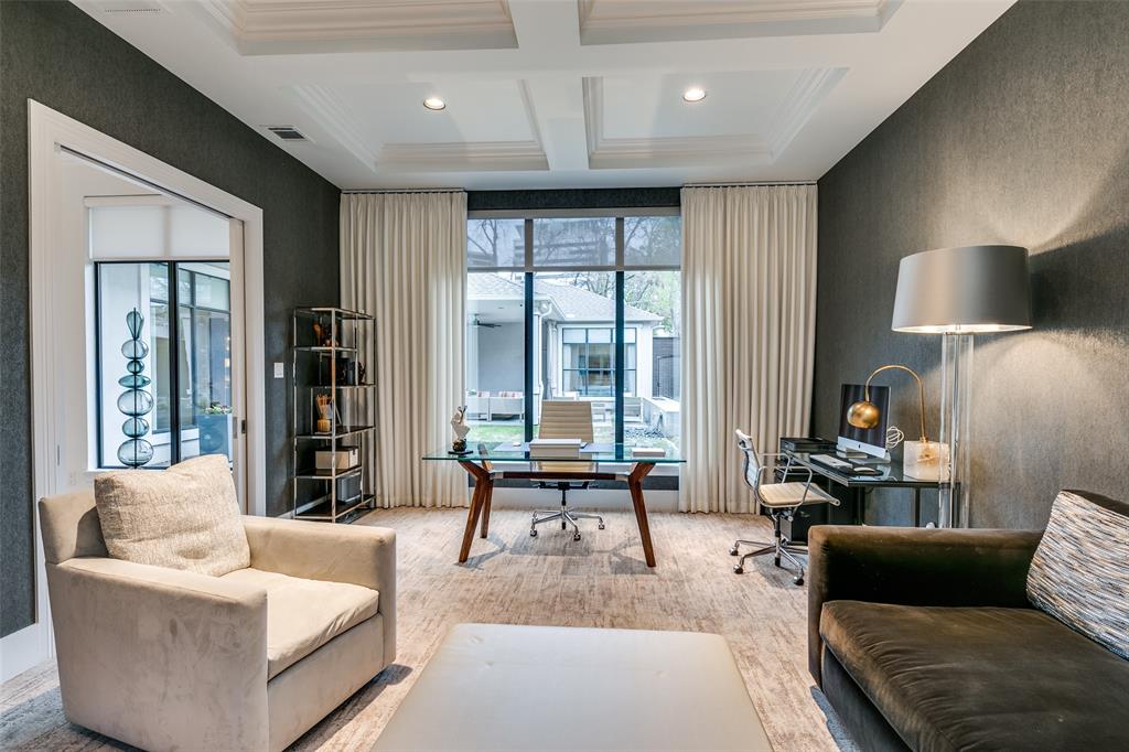 Sophisticated elegance is exemplified throughout this tasteful Hollywood Regency Eclectic Design, custom built in 2012. Recent ownership has completely ushered the home into the 2020's! Built on a c-shaped last, this single-story house indulges natural light at virtually all times of day; the stucco exteriors contribute to its timeless architectural design.  The home is introduced by soft travertine flooring, it belies the appointments within.  A study is privately situated to the entry’s right, it enjoys both north and south exposures. Walls are enhanced by Orion wallcovering and floors are lined with a finely loomed carpet. The space is generous in scale, promoting flexibility as an office, library or secondary living space.  Twin ancillary bedrooms are circuitously set at the northeast section of the house.  Both enjoy the recently remodeled bath, crisply appointed with notable fixtures. An axis to the foyer segues to the recessed Dining Room, adorned with handsome wallcoverings, sconces and draperies; the corridor’s window embankment surveys the cabana style covered porch and landscaped grounds and a fire plinth accented by a relaxing waterfall spillway.  The wine bar is conveniently placed along this corridor. The chef -owner played an active role in the 2023 complete kitchen remodel, which includes a preparation island adorned in quartzite waterfall, a Dacor commercial grade stove with dual ovens, Dacor dual column refrigerator-freezer, DW & microwave. Quartzite walls provide the perfect backdrop for the preparation space; floor to ceiling wood cabinetry with soft close drawers, a Blanco under-mount sink and pantry drawers, & a custom designed coffee station were also part of the intuitive renovation. Form meets function in this brilliantly articulated room. Hardwood flooring, installed in the kitchen seamlessly adjoin a cozy breakfast nook & the Family Rm.