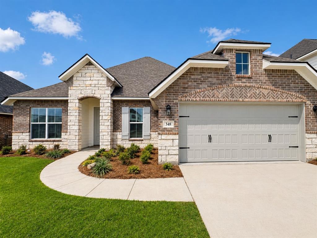 BEAUTIFUL NEW CONSTRUCTION WITH NO BACKYARD NEIGHBORS! *Builder offering $10,000 in concessions!* More photos coming soon! Welcome to our popular Tiara floorplan by Southern Home Builders with an eye-catching intricate stone and brick front fascade! 348 Prien Lake Loop is located in Edgewater Pass, our newest section of the Legacy development in North Bossier known for its convenient location, excellent public schools, and beautiful grounds with sidewalks, a community pool, fishing ponds, and more! This floor plan offers 1984 square feet of well utilized footage all on one floor with 3 bedrooms, 2 bathrooms, a formal dining room, an office with gorgeous glass French doors, a 2-car garage, and a grand open kitchen and living space! This is not your average spec home with upgrades inside and out including popular leathered feel granite countertops in kitchen and baths, crisp white cabinets, neutral and warm trendy wall color, lovely darker engineered wood floors, gas start wood burning fireplace, built in cabinets and floating shelves on each side of the fireplace, tray ceilings with LED lighting, crown molding, cased windows, can lighting, and window blinds already installed (a $1500 value)! Additionally in the kitchen you'll find white cabinets with nickel hardware, a white subway tile backsplash, stainless-steel GE appliances with a flat gas range, and a breakfast bar. The primary suite is spacious with plenty of room for all of your furniture, a generous closet, lovely freestanding bathtub, dual sinks, and a fully tiled shower with a bench and frameless glass! Rest easy knowing all systems are brand new and this home comes complete with New Home Warranties, less maintenance and fewer weekend projects! Easy commute down Swan Lake Rd, close to Legacy Elementary, and easy access to all things North Bossier, Barksdale Air Force Base, and I-220! Be sure to take advantage of these $10,000 builder incentives to be used as you please - closing costs, buy down, or fencing!