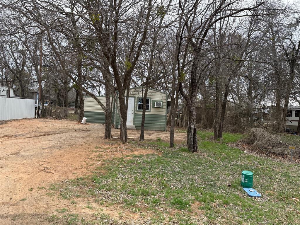This adorable tiny home is ready for you to move in.  It's located at Promontory Park, lot #35, just been remodeled, ALL ELECTRIC, new septic system, with a 500 gallon concrete tank, new flooring, new paint, new tub-shower unit, new commode, new vanity, new cook stove, new on-demand water heater.  Two window units that's heat and air. All kitchen appliances and furniture will convey. Located on the Promontory side of Proctor Lake. Promontory Park has an inground swimming pool, pavilion, trash services, boat loading dock is available at the lake, a place to burn your trash.
Monthly dues are 30.00.  What a deal at $90,000.00        SELLER WILL CONSIDER OWNER FINANCING WITH A REASONABLE DOWN PAYMENT...
