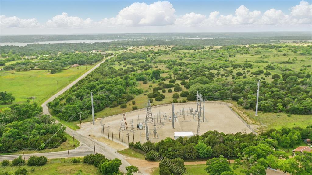 Incredible opportunity to own 292 acres of prime real estate in rapidly growing eastern Parker County, just north of Willow Park. With its unbeatable location—only 20 miles to Fort Worth and 11 miles to Weatherford—this property offers endless potential for residential development, commercial ventures, or long-term investment. The land is currently under an agricultural exemption and features expansive open acreage with excellent road frontage. Heavy power lines traverse the property, and a power substation is located directly across the road, offering substantial utility infrastructure for future projects. Whether you're looking to create a master-planned community, establish a business hub, or invest in one of the most sought-after areas in North Texas, this property checks all the boxes. Don’t miss this rare chance to secure a large tract in a premier location.