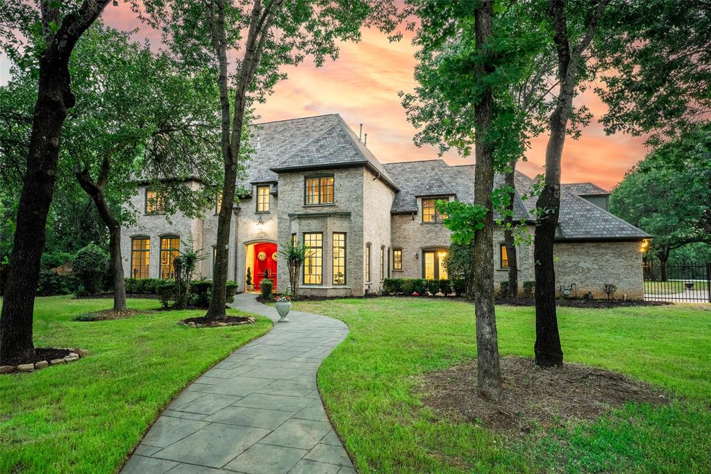TRANSFORM to your dream home! Price reduced AND $50k for your customization! Welcome to the executive gated Flower Mound neighborhood, The Landing. The Tudor-style, cul-de-sac home is nestled on 2 ac, and backs to corps property and Grapevine Lake.  Stately curb appeal with mature trees, provides a sense of exclusivity and privacy.  Stepping inside the foyer, is the light-filled living, dining rooms and stairway. The kitchen is open to the large wood-beamed family room and breakfast nook, creating an ideal space for both intimate gatherings and lavish entertaining.  Work from home in the office, with built-in shelving and desk, and take a break out the double patio doors for fresh air.  Also on the first floor off the utility room is a flex space for a second office, exercise room or bedroom. 
Upstairs is a large loft, 4 bdrms, media room, secondary flex space and 2 bathrooms. Backyard sanctuary features a covered patio, sparkling pool, and fenced versatile sport court. 15 min to DFW!