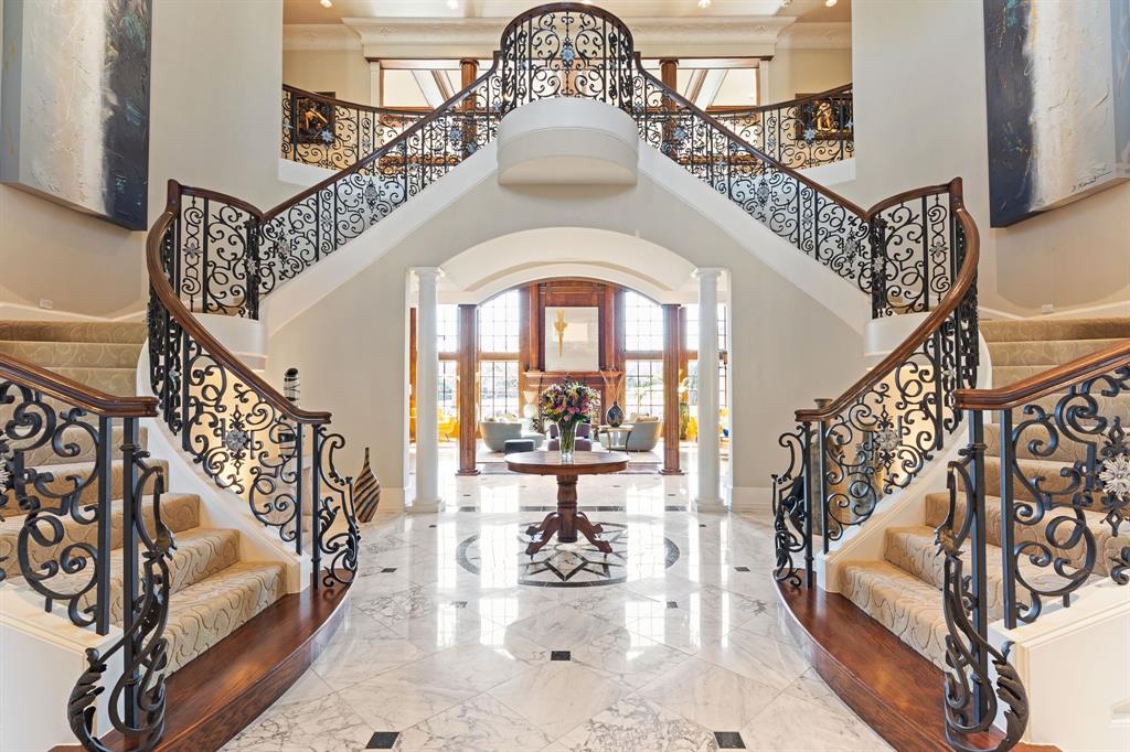 Welcome to a home that isn’t just a masterpiece, it’s a legend. Built for legendary football player and Heisman Trophy winner, Herschel Walker, this extraordinary Cottonwood Valley estate spans two prime golf course lots, offering front-row views of the 16th fairway. From the stately circle drive to the cast stone detailing, dual electronic gates, and copper gutters, every inch exudes elegance.  Step through the grand 10-foot oak arched doors into a world of refinement. A breathtaking wrought iron dual staircase, soaring ceilings, and intricate crown molding set the tone. Flanking the entry, two elegant formals sparkle under Waterford Crystal chandeliers. The great room is nothing short of spectacular, 600+ square feet of entertainment space with 24-foot ceilings, floor-to-ceiling rich wood paneling, and a modern fireplace. Towering two-story windows frame amazing views of the pool and golf course.  A chef’s dream, the remodeled kitchen boasts an oversized island, 2 Dacor & 2 Wolf ovens, a Subzero fridge, 2 dishwashers, and a cozy living area with a fireplace. The adjacent breakfast nook overlooks the backyard oasis. The primary suite is a true retreat, featuring a sitting area, fireplace, & breathtaking golf course views. Its spa-like bath offers a jetted tub, dual walk-in closets, & a private coffee bar. Additional guest suites provide luxurious accommodations, while a dedicated home theater with wet bar & seating for 12 transforms movie nights. Outdoor living is elevated with two expansive shaded patios, Bose speakers, & an elegant pool with LED lighting & a waterfall feature. A Viking grill & private pool bath complete the space, making it perfect for entertaining. With dual laundry rooms, extensive storage, seven geothermal HVAC units, & whole-house Taexx pest control, this estate blends timeless elegance with modern convenience. 1600 Nelson Drive isn’t just a home, it’s an experience. A statement of luxury, design, & craftsmanship, waiting for its next owner.