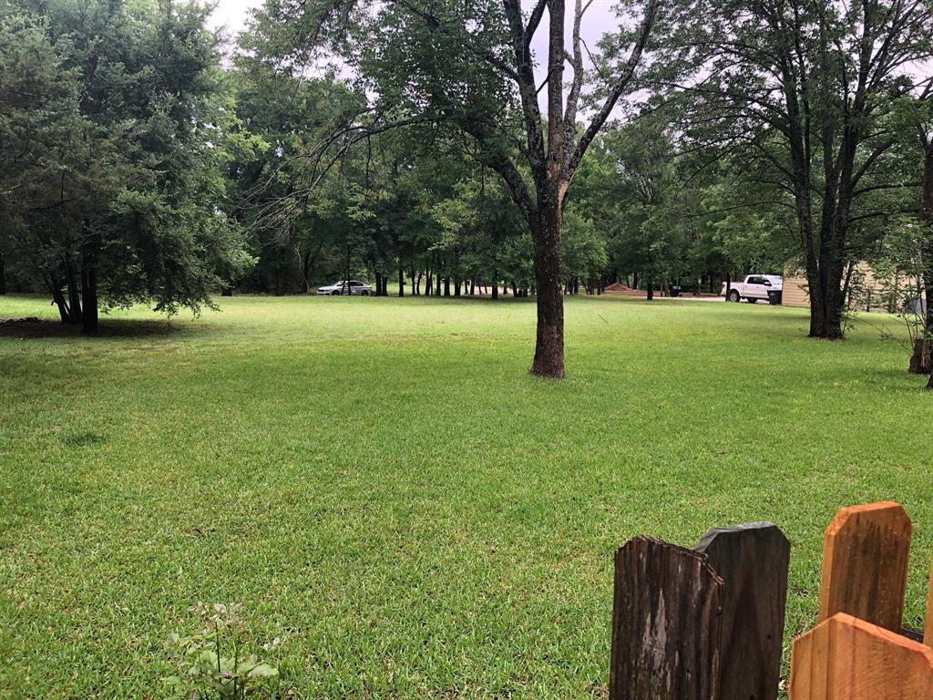 Prime location in Thompson Heights at Lake Texoma.  Beautiful partially wooded, flat half acre building site for your home and toy garage. This property is perfect for a full time resident or part time weekends at the lake. New construction on this site has potential for a seasonal lake view. Several new homes have been built nearby and this is the last available lot. Walking distance to Eisenhower State Park recreation area, marina and boat ramp. Denison schools and easy access to I-75, shopping and services. No HOA!
